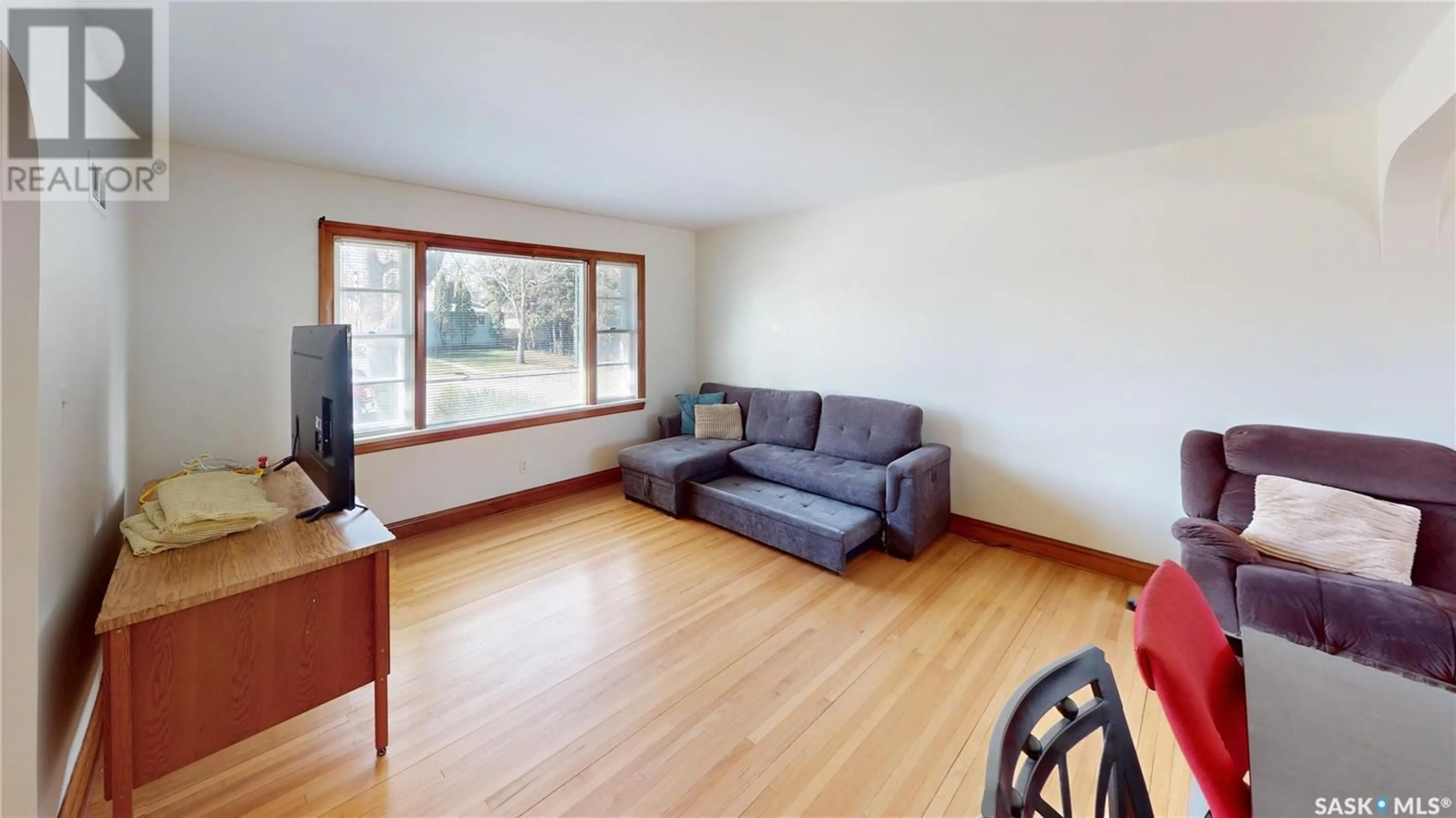 Living room with furniture, wood/laminate floor for 2712 SINTON AVENUE, Regina Saskatchewan S4S1K1