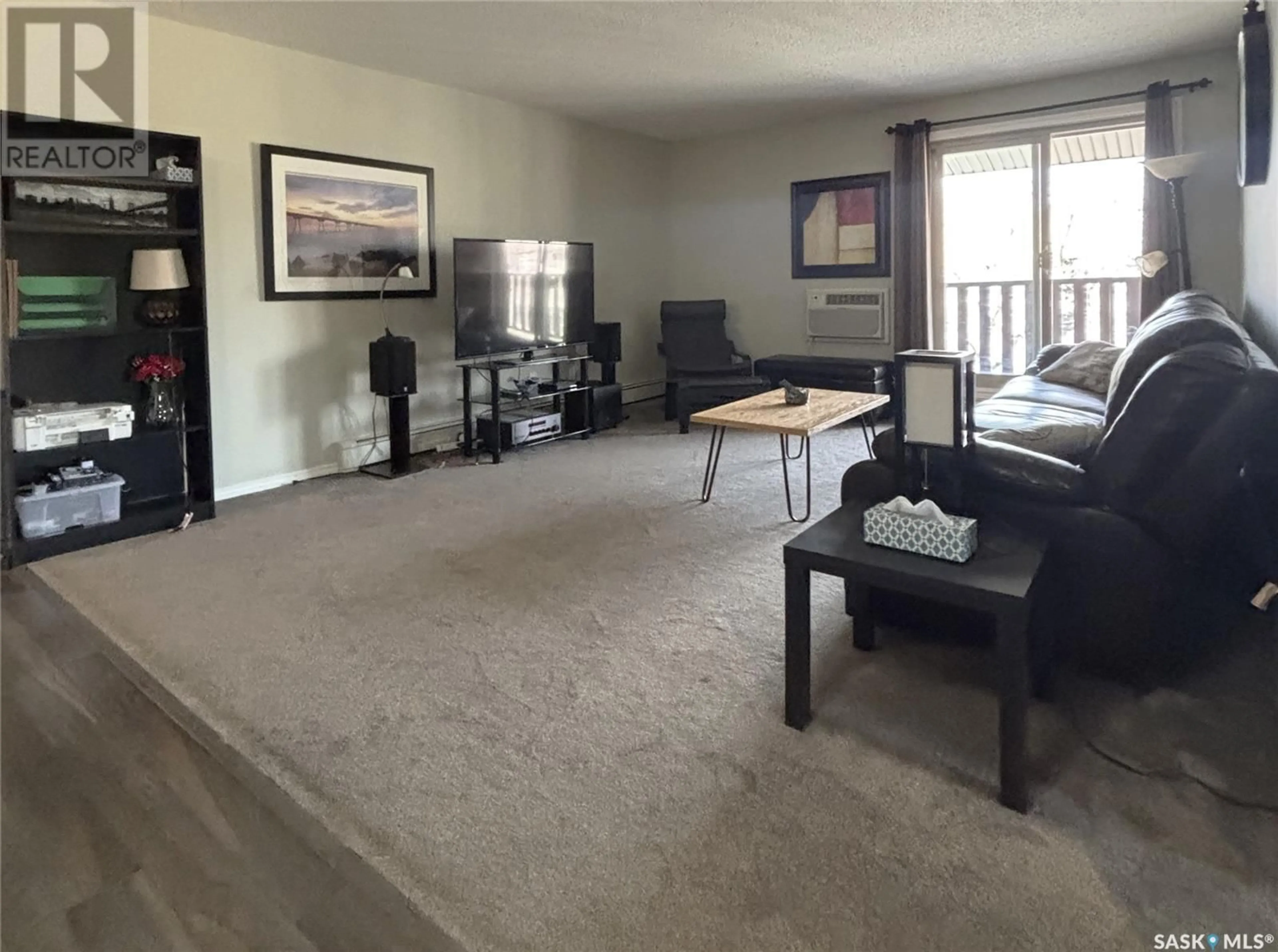 Living room with furniture, carpet floor for 301F - 1121 MCKERCHER DRIVE, Saskatoon Saskatchewan S7H5B8
