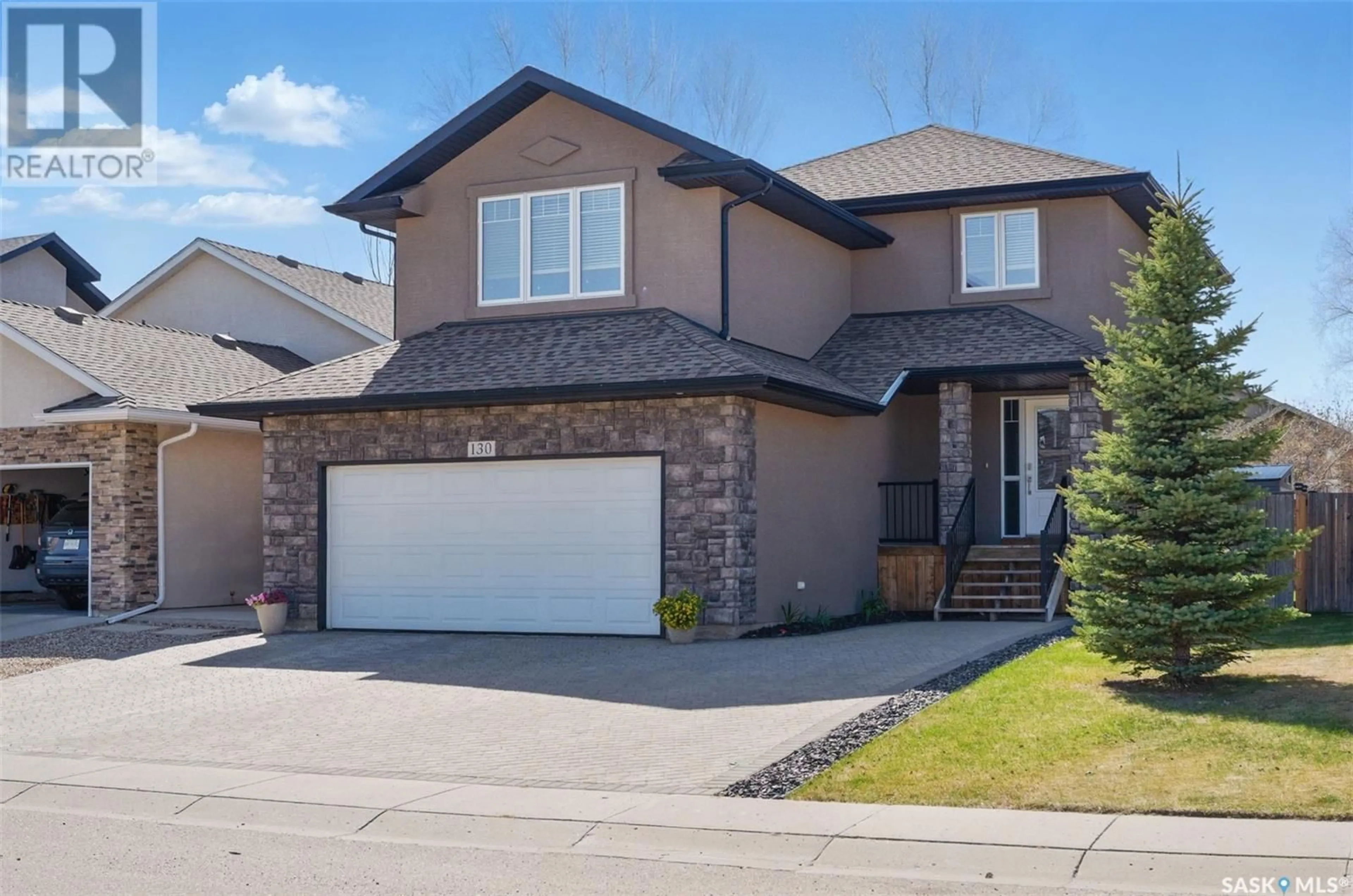 Home with vinyl exterior material, street for 130 BLACKSTOCK COVE, Saskatoon Saskatchewan S7T0H4