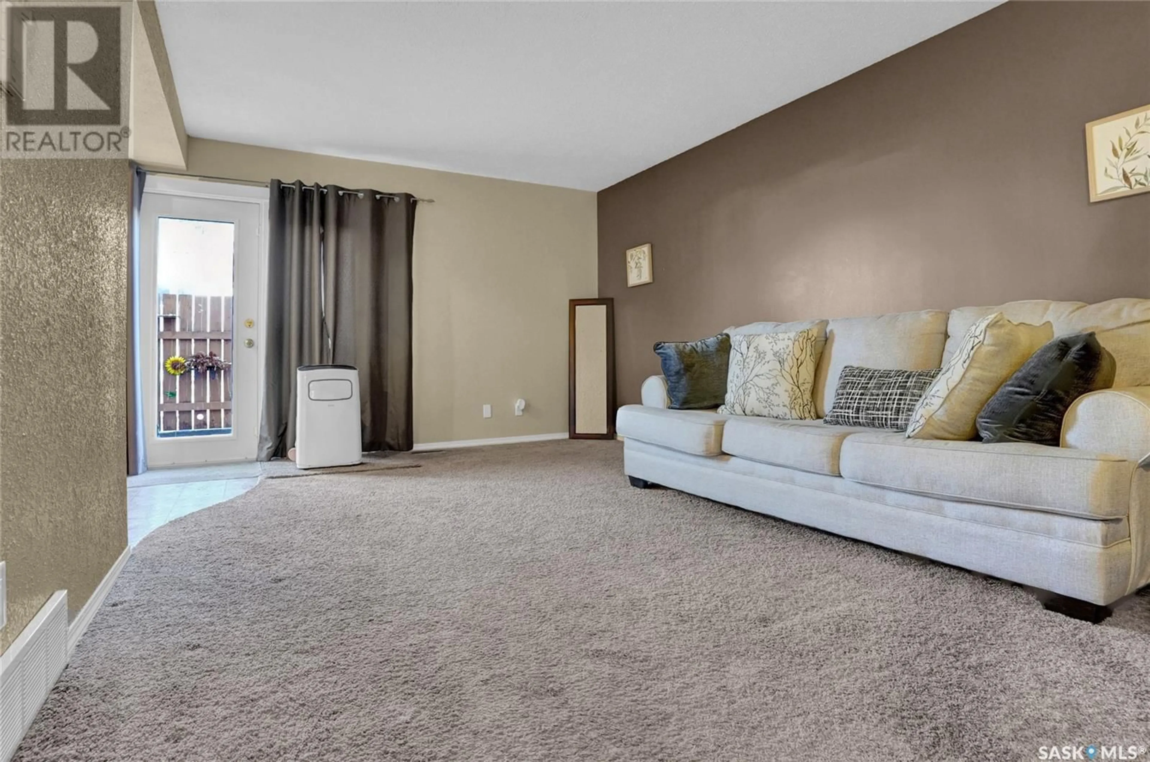 Living room with furniture, carpet floor for 4208 CASTLE ROAD, Regina Saskatchewan S4S4W1