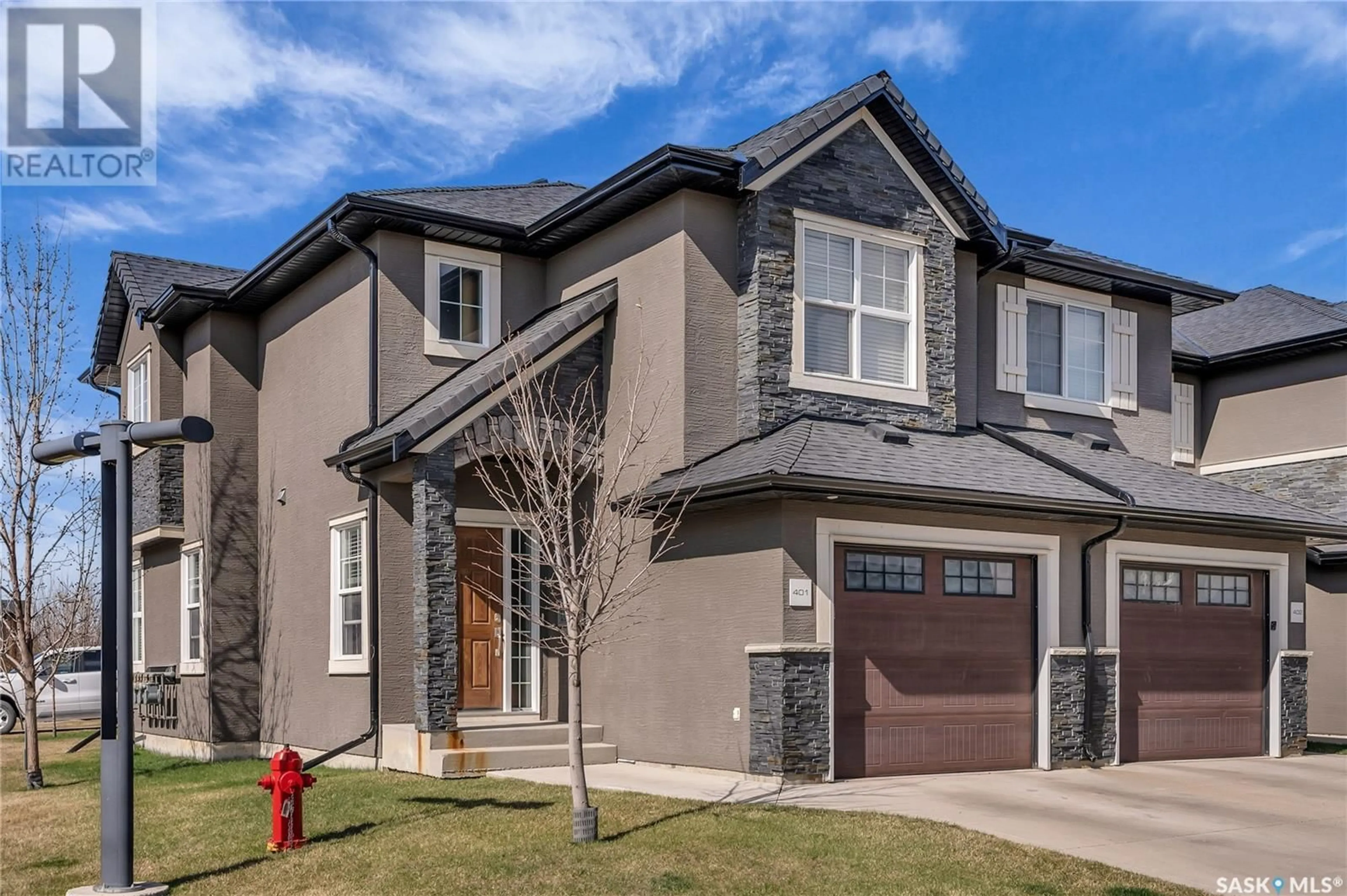 Home with brick exterior material, street for 401 - 1303 PATON CRESCENT, Saskatoon Saskatchewan S7W0P6