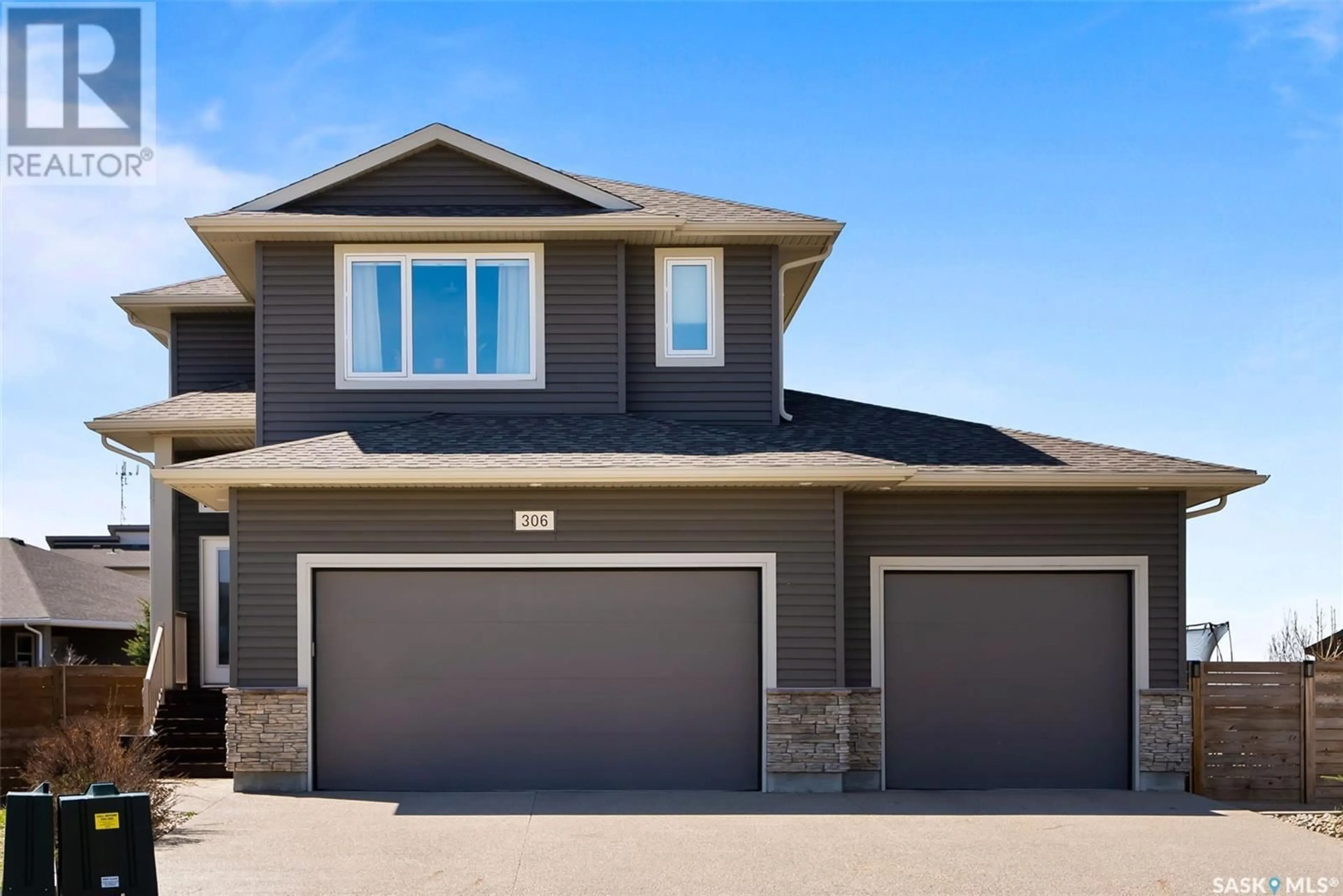 Home with vinyl exterior material, street for 306 PLAINS COURT, Pilot Butte Saskatchewan S0G3Z0