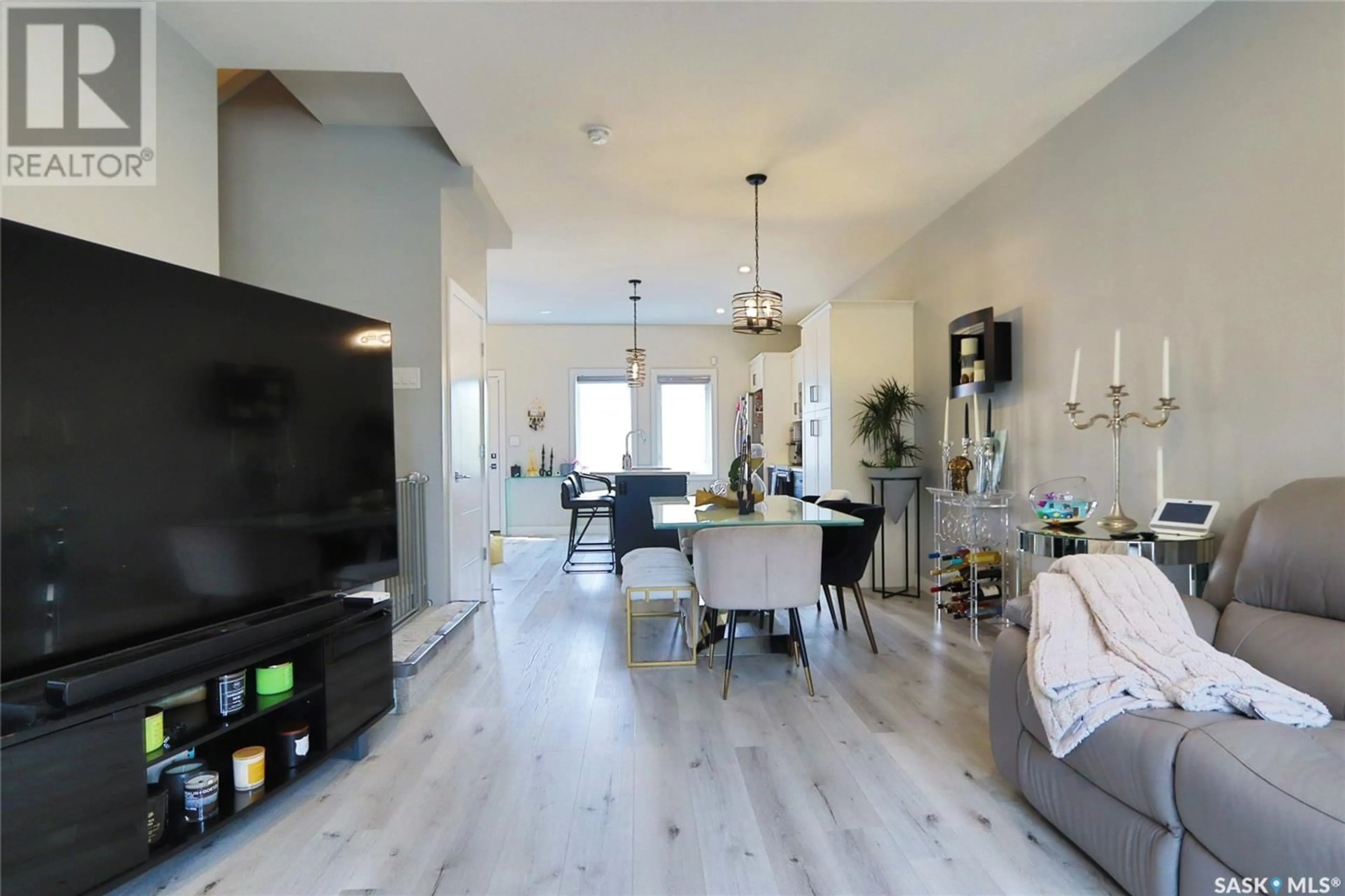 Living room with furniture, wood/laminate floor for 2260 WASCANA STREET, Regina Saskatchewan S4S6Y9