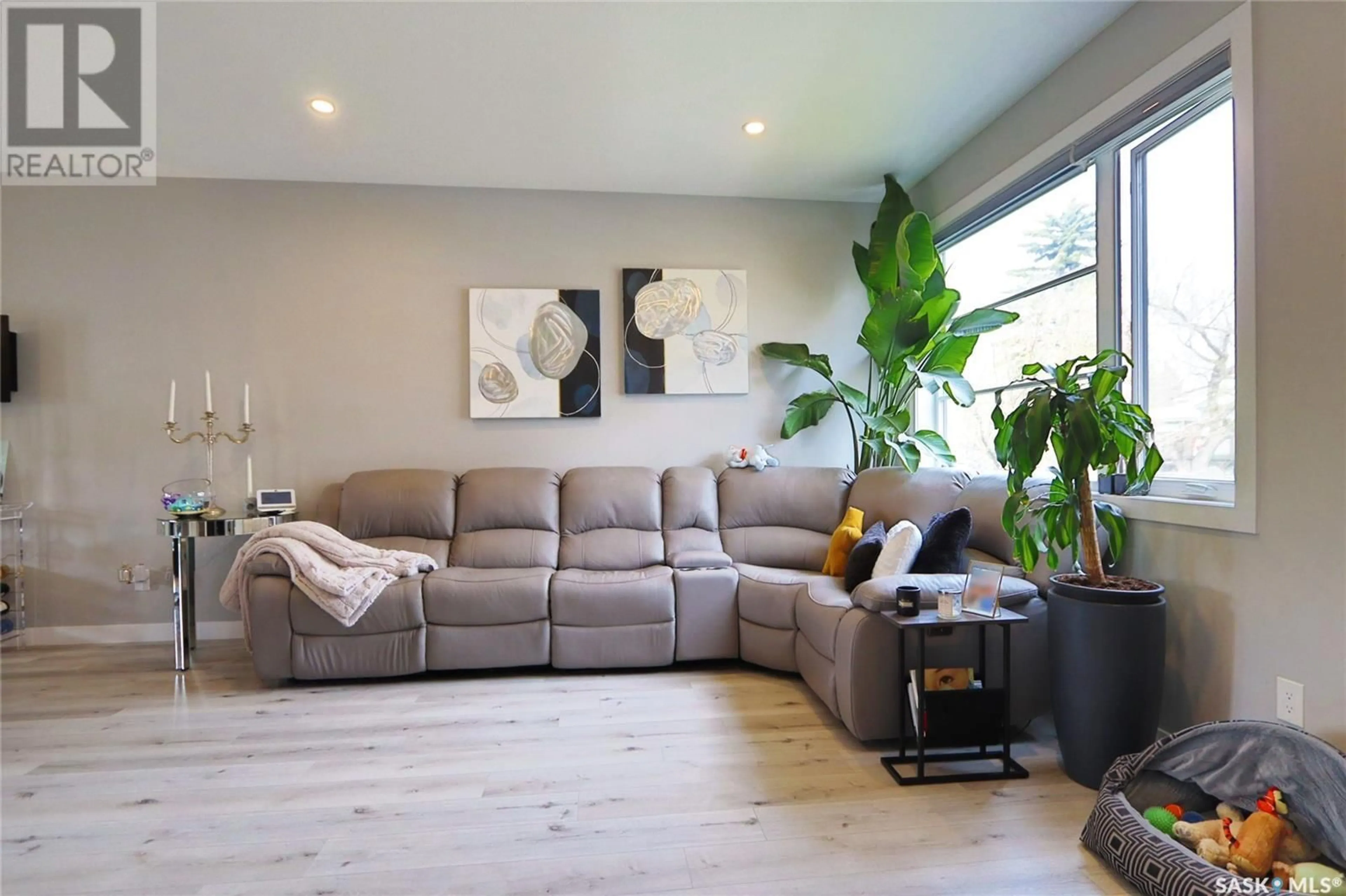 Living room with furniture, wood/laminate floor for 2260 WASCANA STREET, Regina Saskatchewan S4S6Y9