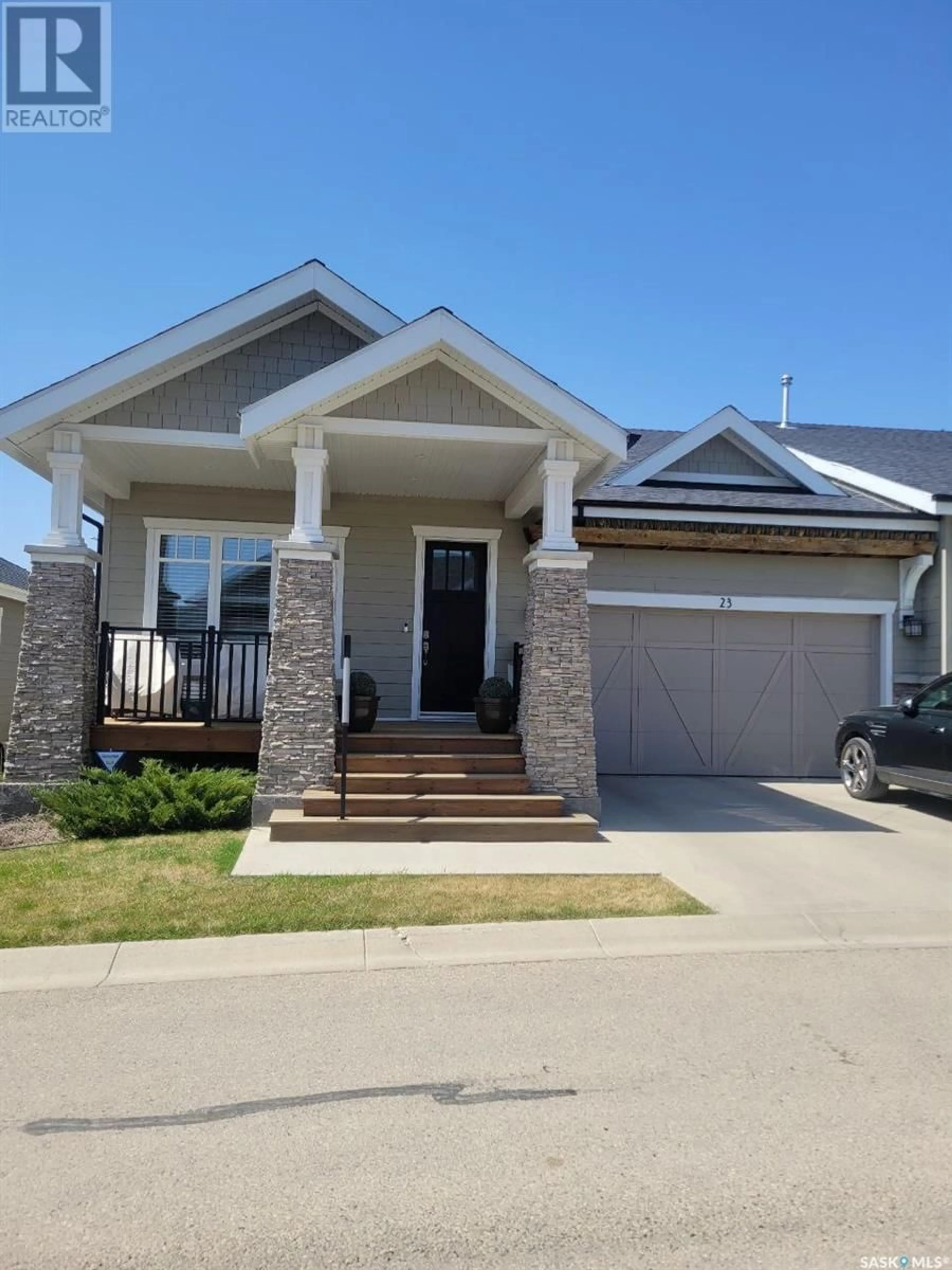 Home with brick exterior material, street for 23 115 MEADOWS BOULEVARD, Saskatoon Saskatchewan S7V0E4