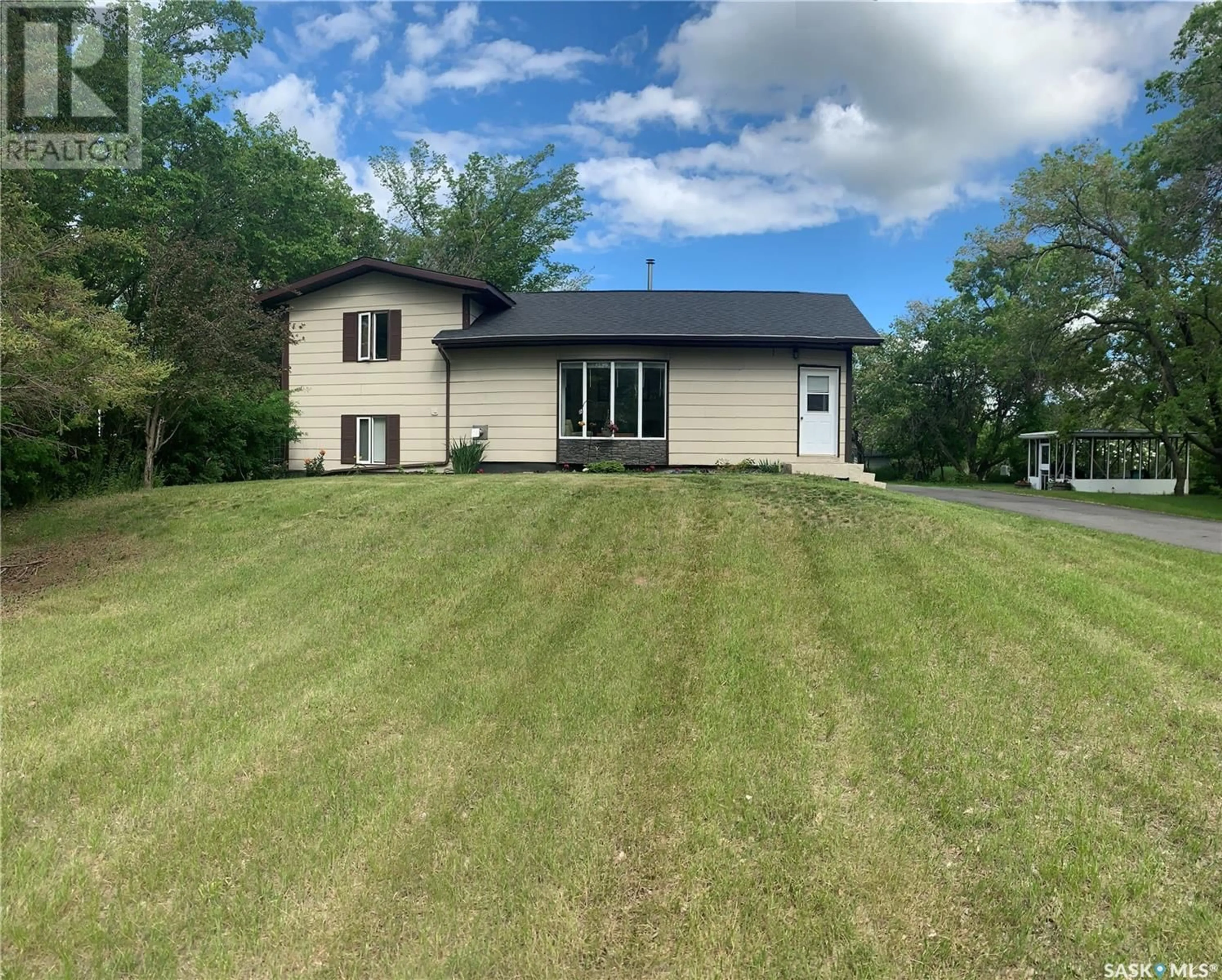 A pic from outside/outdoor area/front of a property/back of a property/a pic from drone, water/lake/river/ocean view for 307 365 HIGHWAY, Manitou Beach Saskatchewan S0K4T1