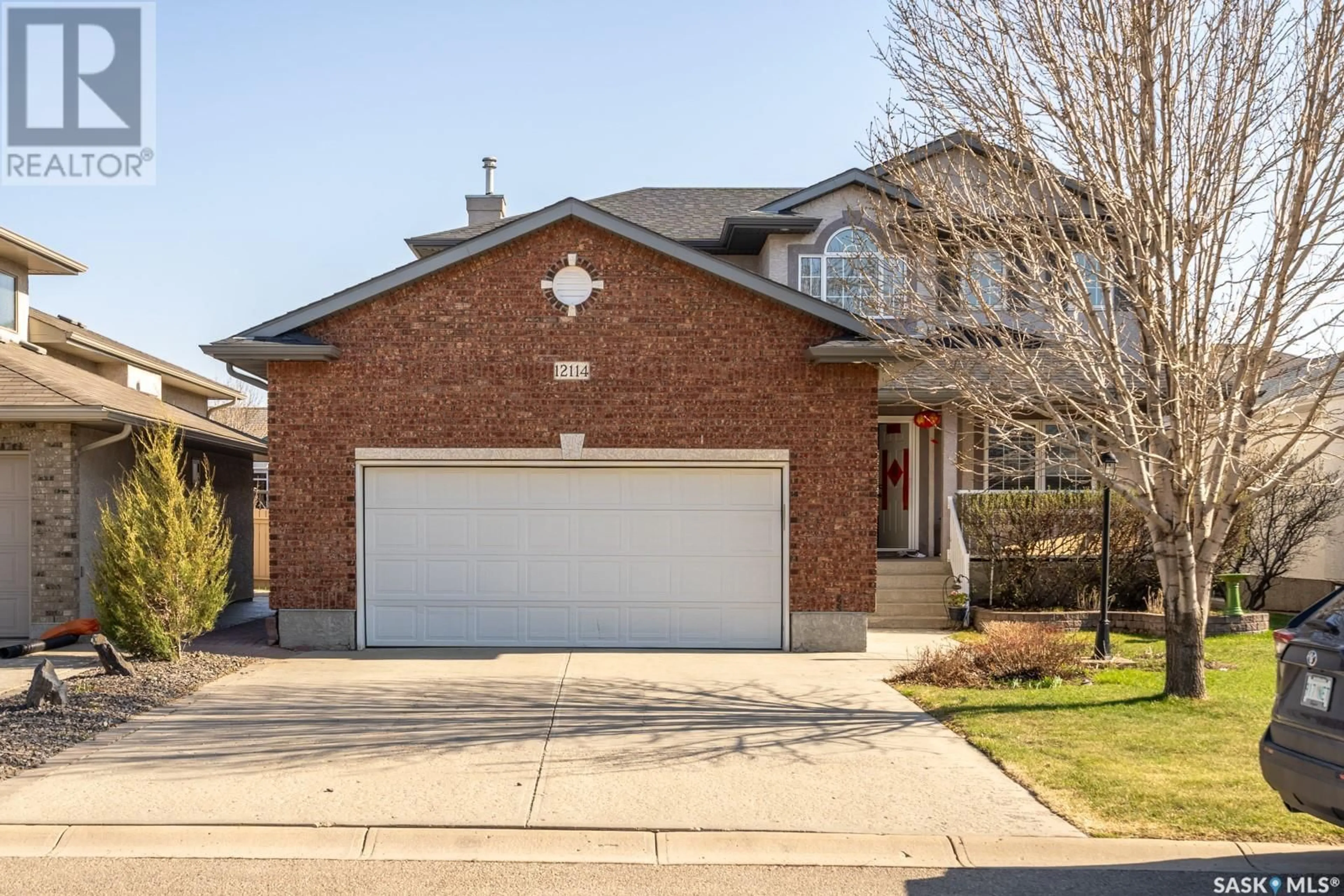 Home with brick exterior material, street for 12114 WASCANA HEIGHTS, Regina Saskatchewan S4V3C2