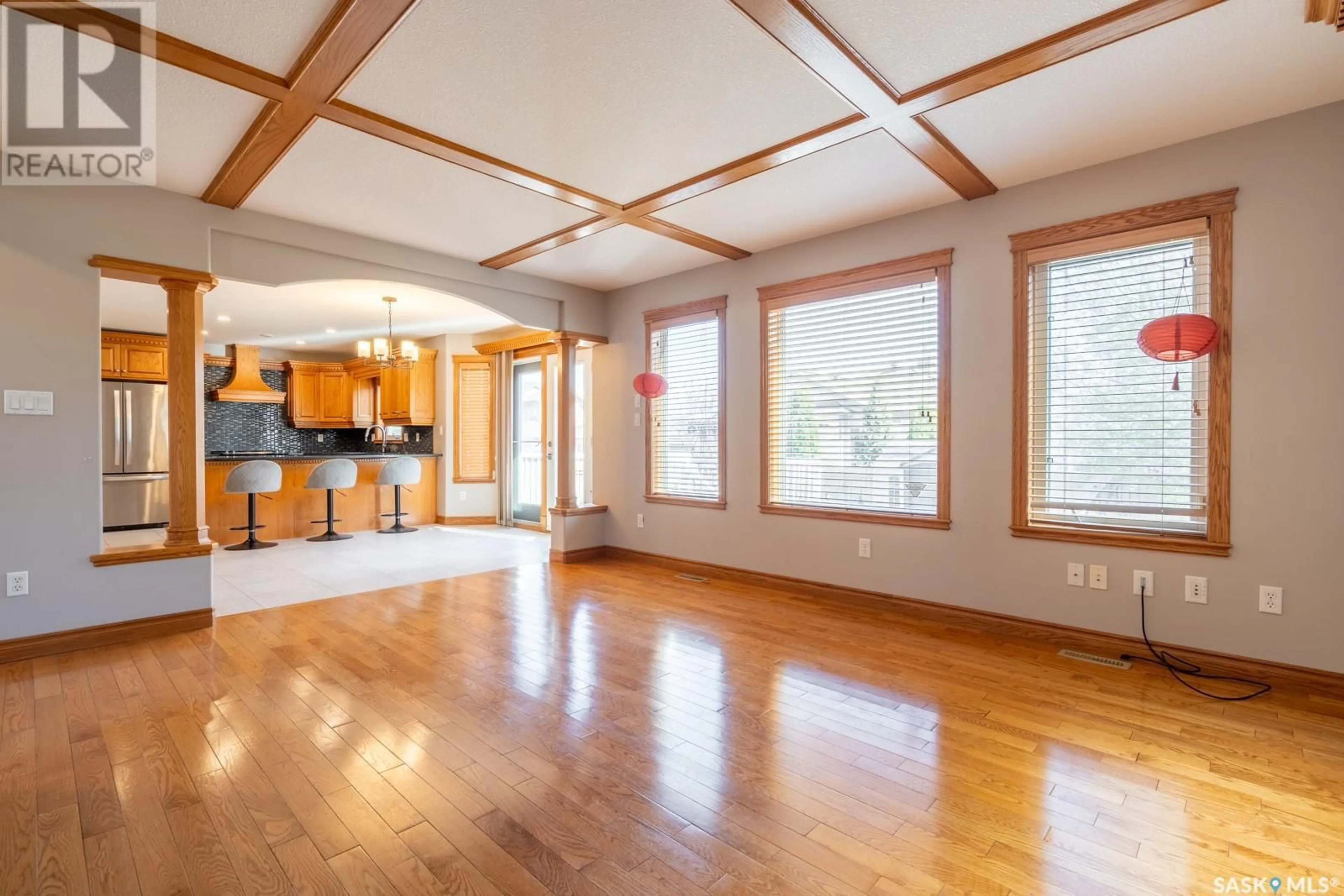 Open concept kitchen, wood/laminate floor for 12114 WASCANA HEIGHTS, Regina Saskatchewan S4V3C2