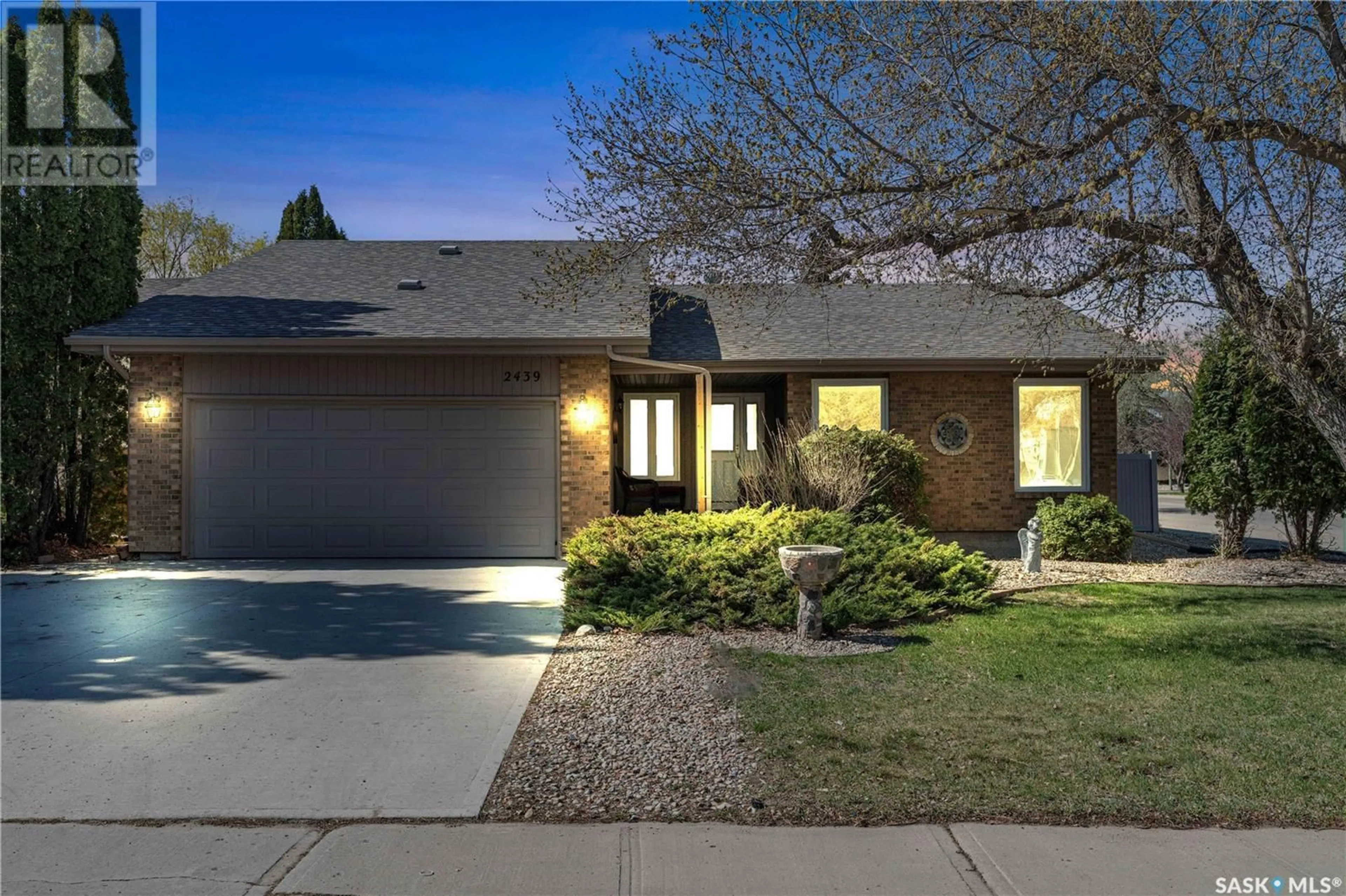 Home with brick exterior material, street for 2439 STRATHMORE PLACE, Regina Saskatchewan S4V0Z1