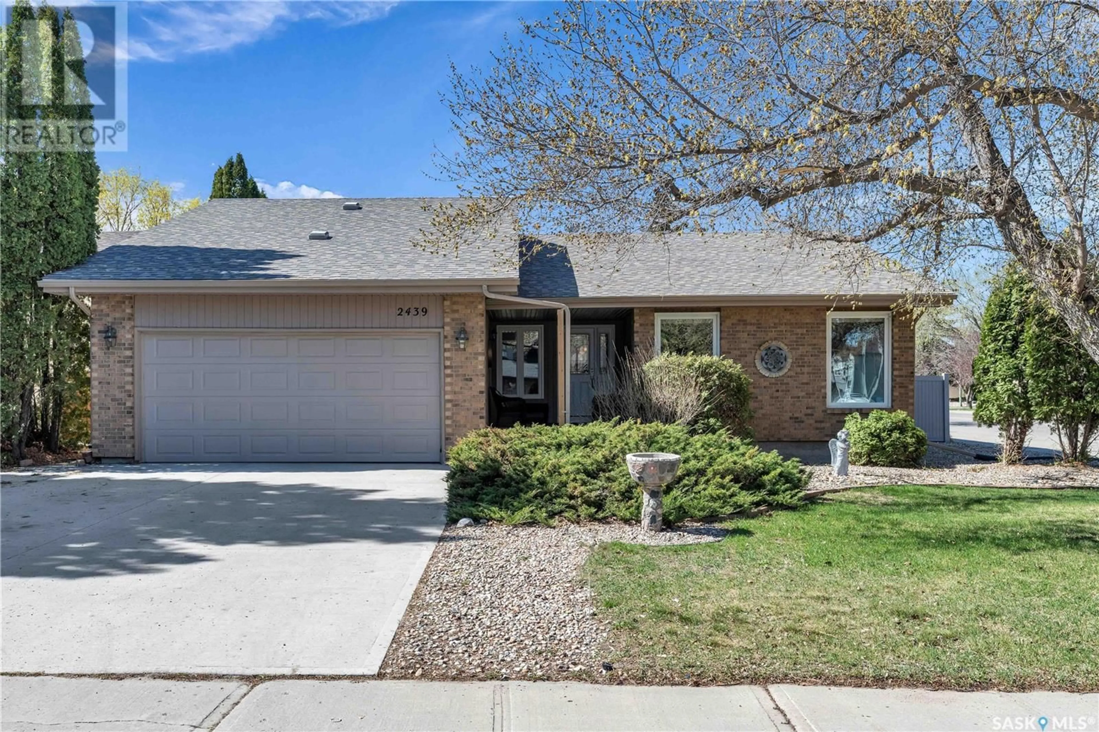 Home with brick exterior material, street for 2439 STRATHMORE PLACE, Regina Saskatchewan S4V0Z1