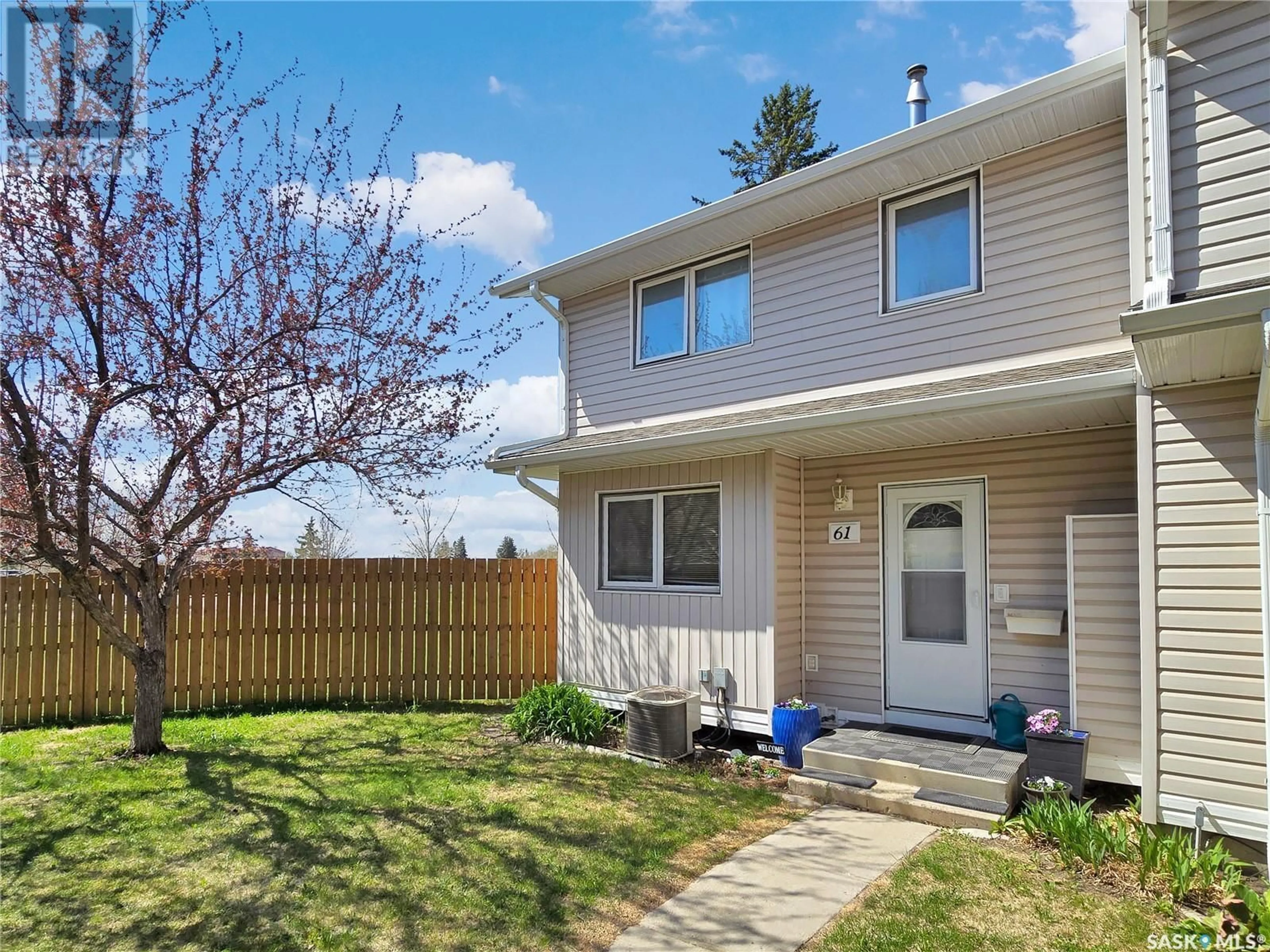 Home with vinyl exterior material, street for 61 330 HAIGHT CRESCENT, Saskatoon Saskatchewan S7H4V9