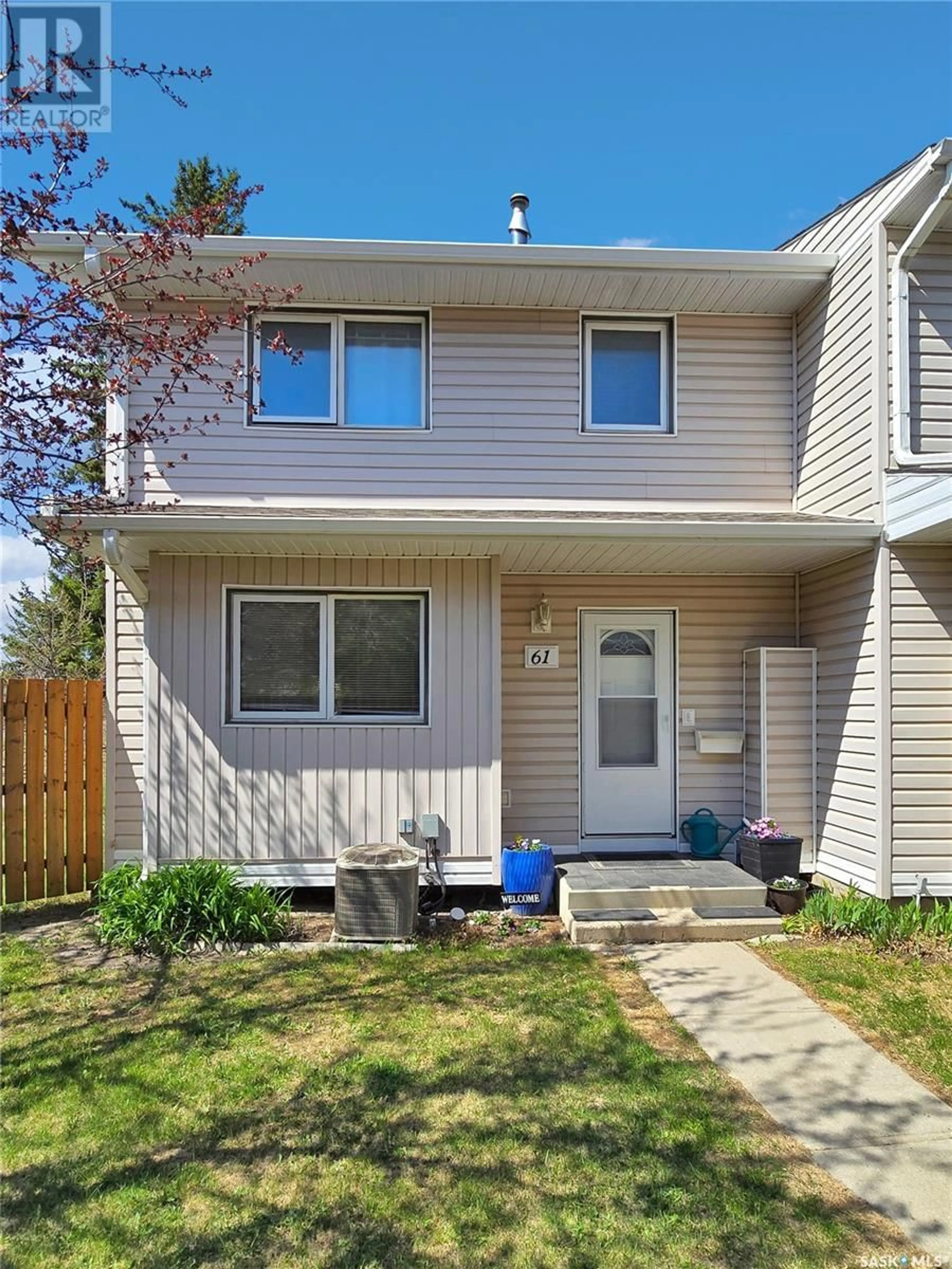 Home with vinyl exterior material, street for 61 330 HAIGHT CRESCENT, Saskatoon Saskatchewan S7H4V9