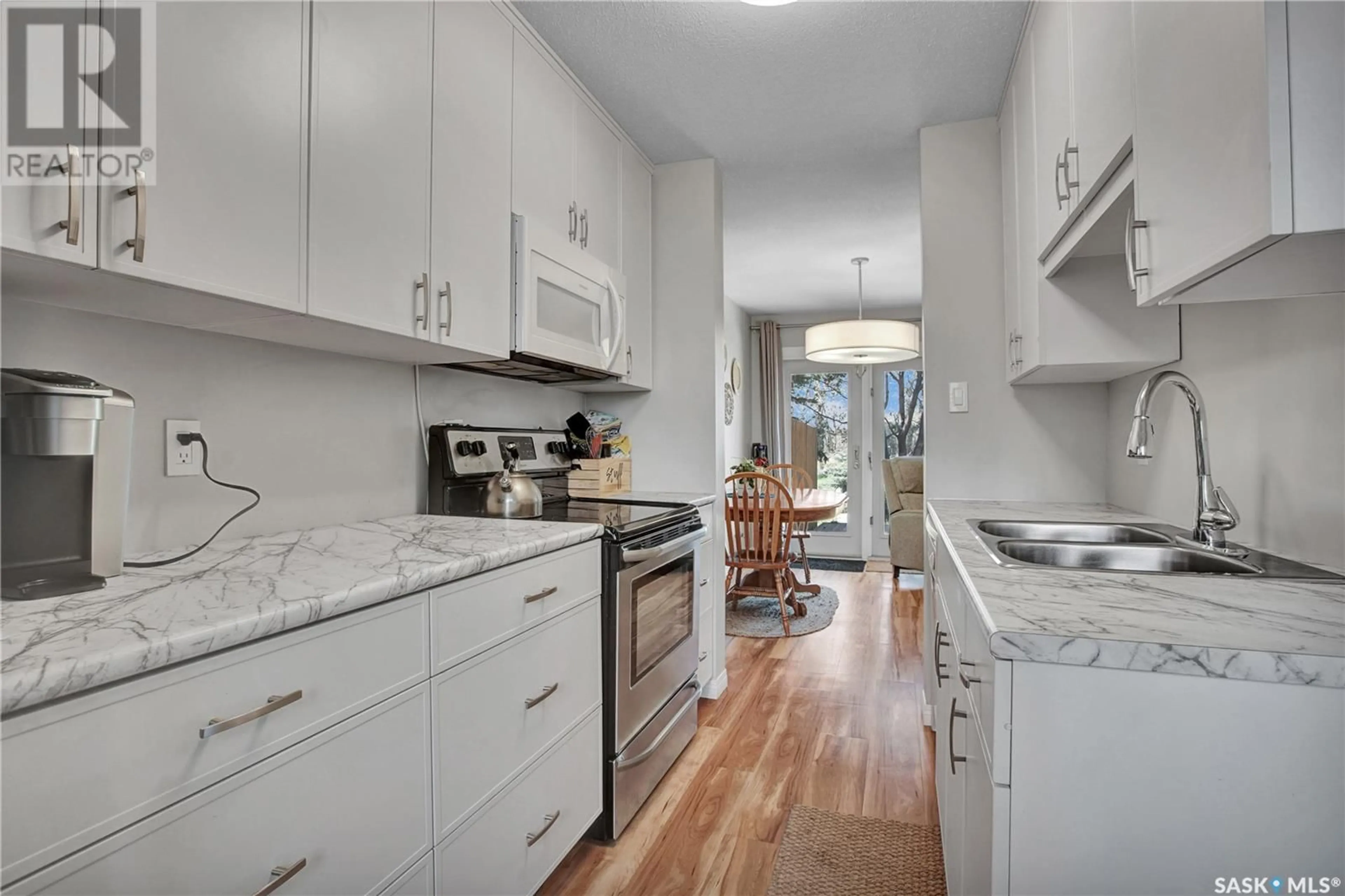 Open concept kitchen, ceramic/tile floor for 61 330 HAIGHT CRESCENT, Saskatoon Saskatchewan S7H4V9