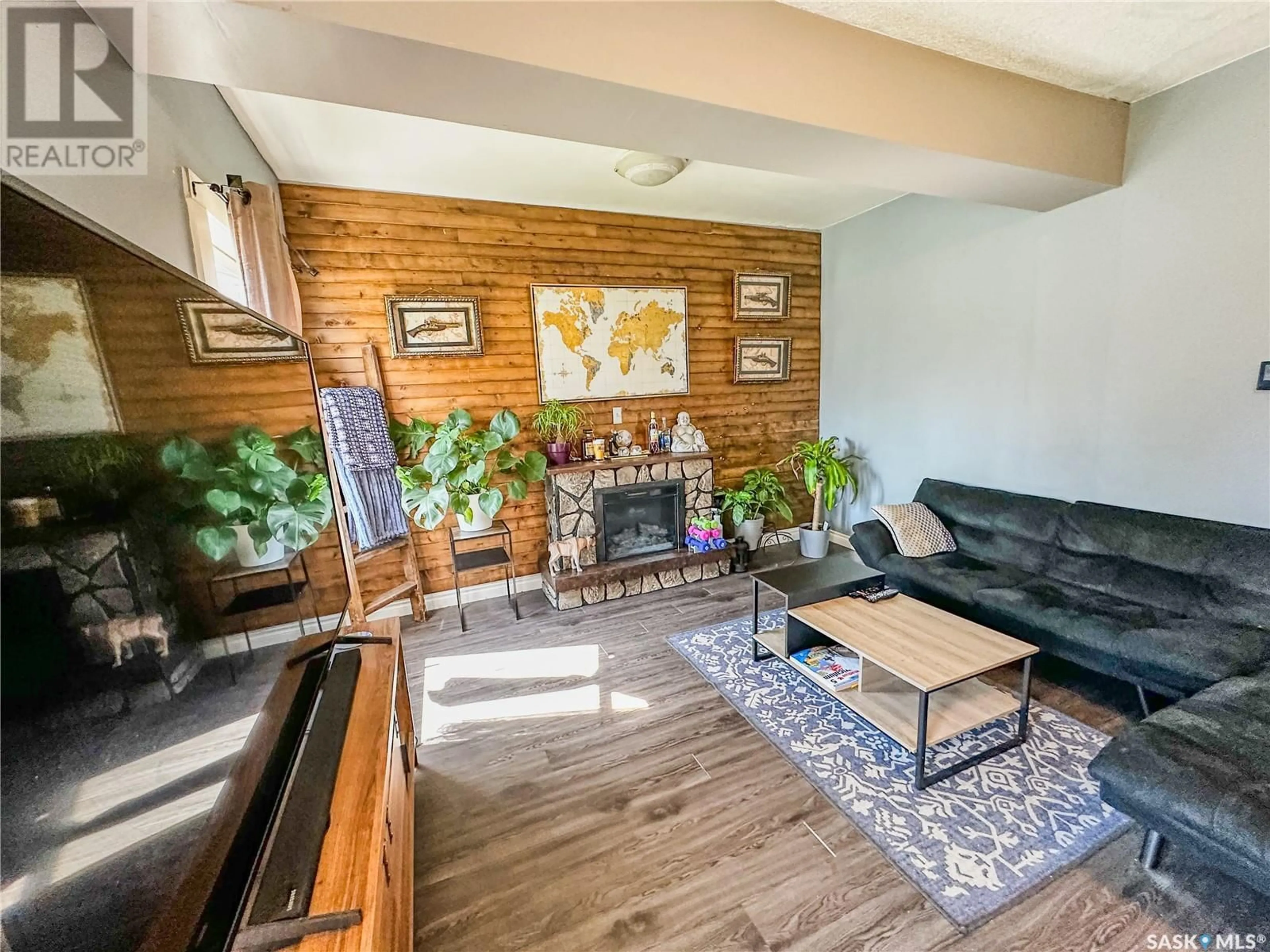 Living room with furniture, wood/laminate floor for 344 3RD AVENUE, Melville Saskatchewan S0A2P0