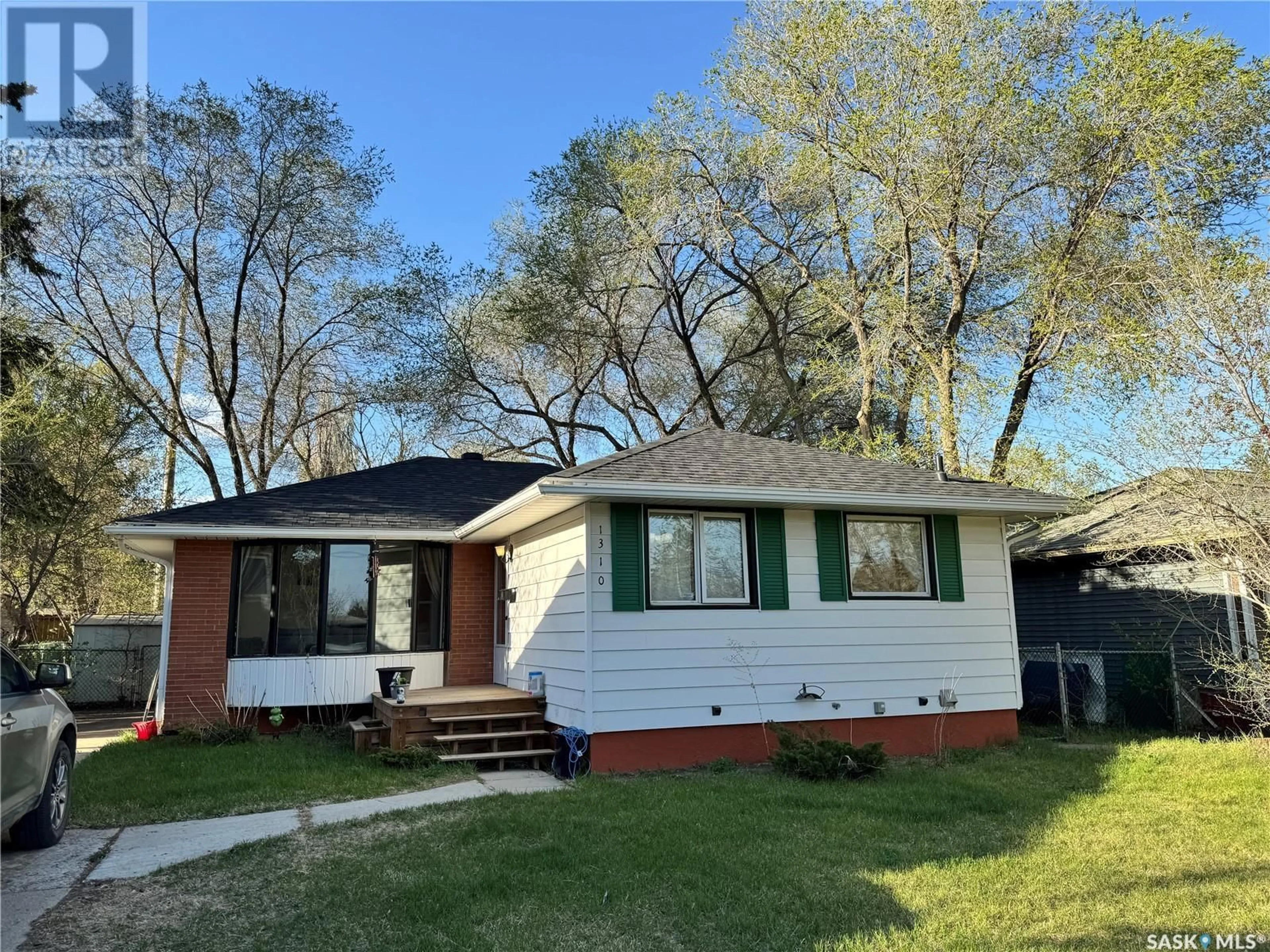 Home with vinyl exterior material, street for 1310 33RD STREET, Saskatoon Saskatchewan S7L0W9