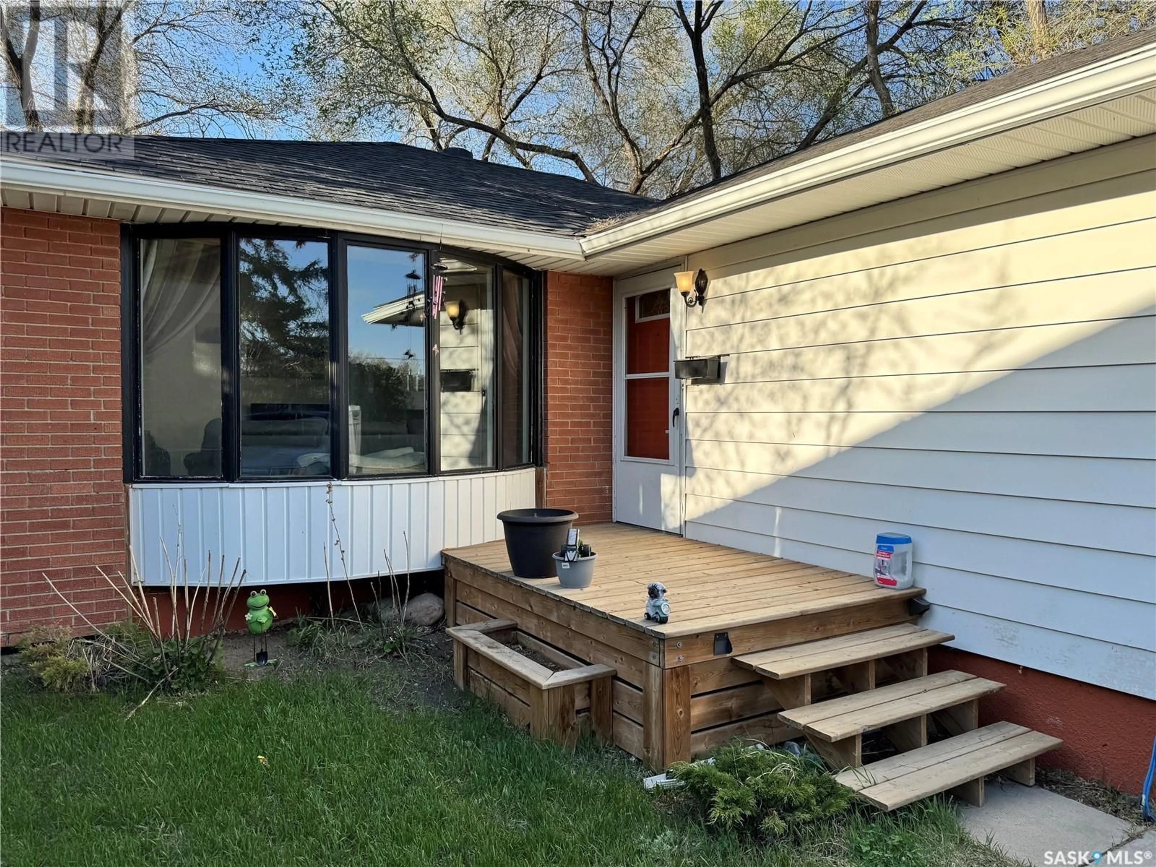 Home with vinyl exterior material, street for 1310 33RD STREET, Saskatoon Saskatchewan S7L0W9