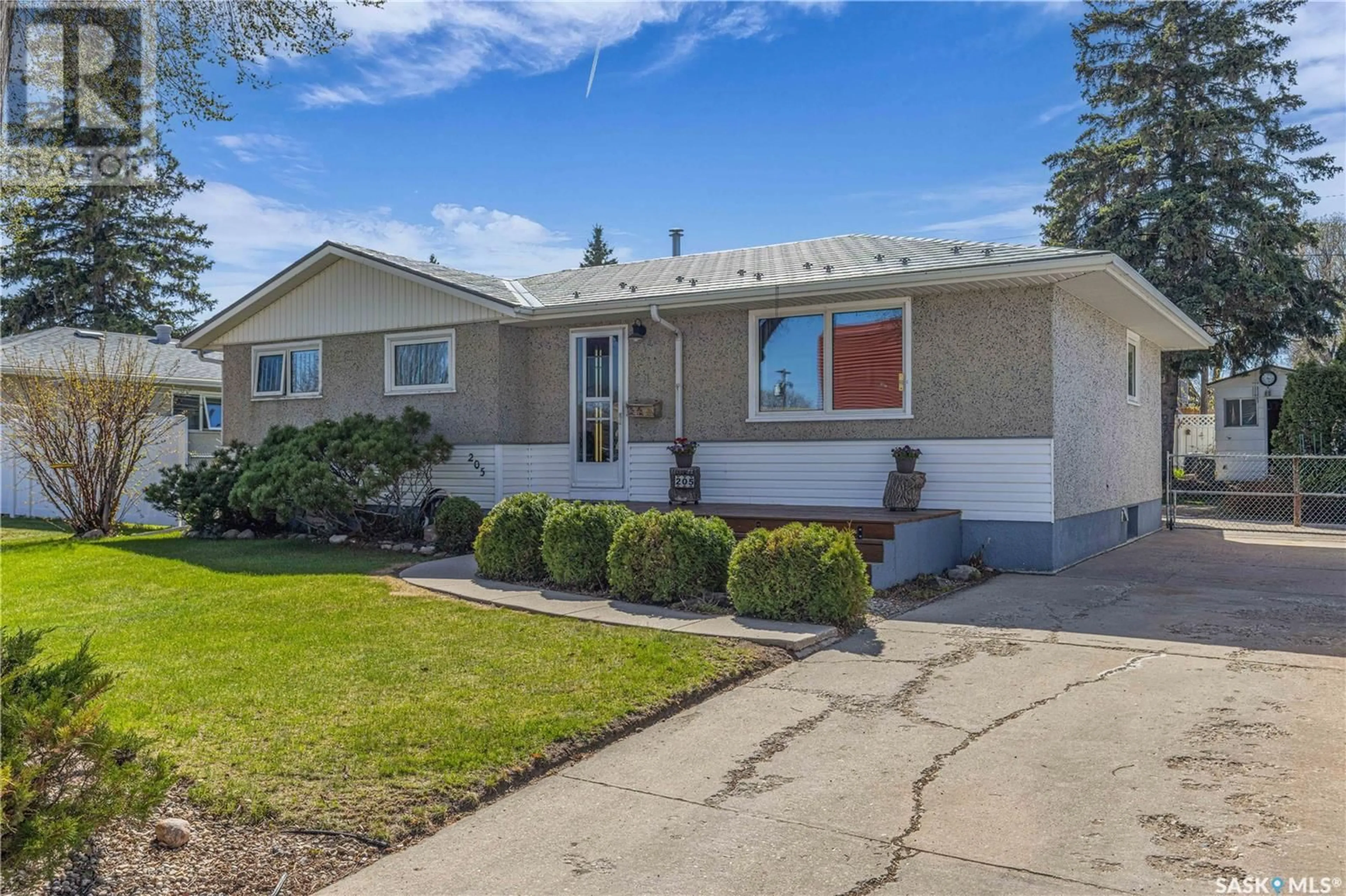 Home with vinyl exterior material, street for 205 OTTAWA AVENUE, Saskatoon Saskatchewan S7L3N9