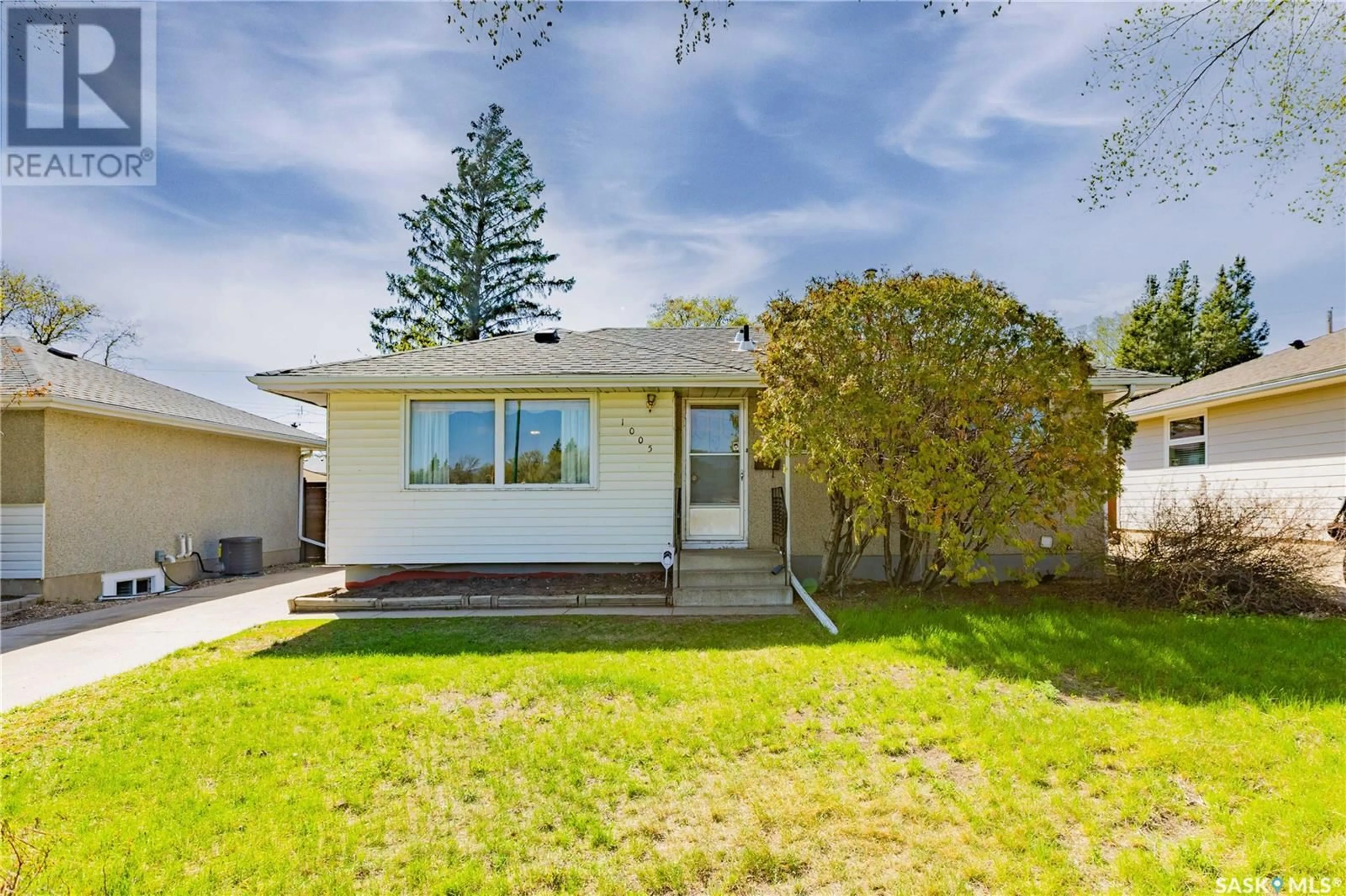 Home with vinyl exterior material, street for 1005 MCMILLAN AVENUE, Saskatoon Saskatchewan S7L2T9