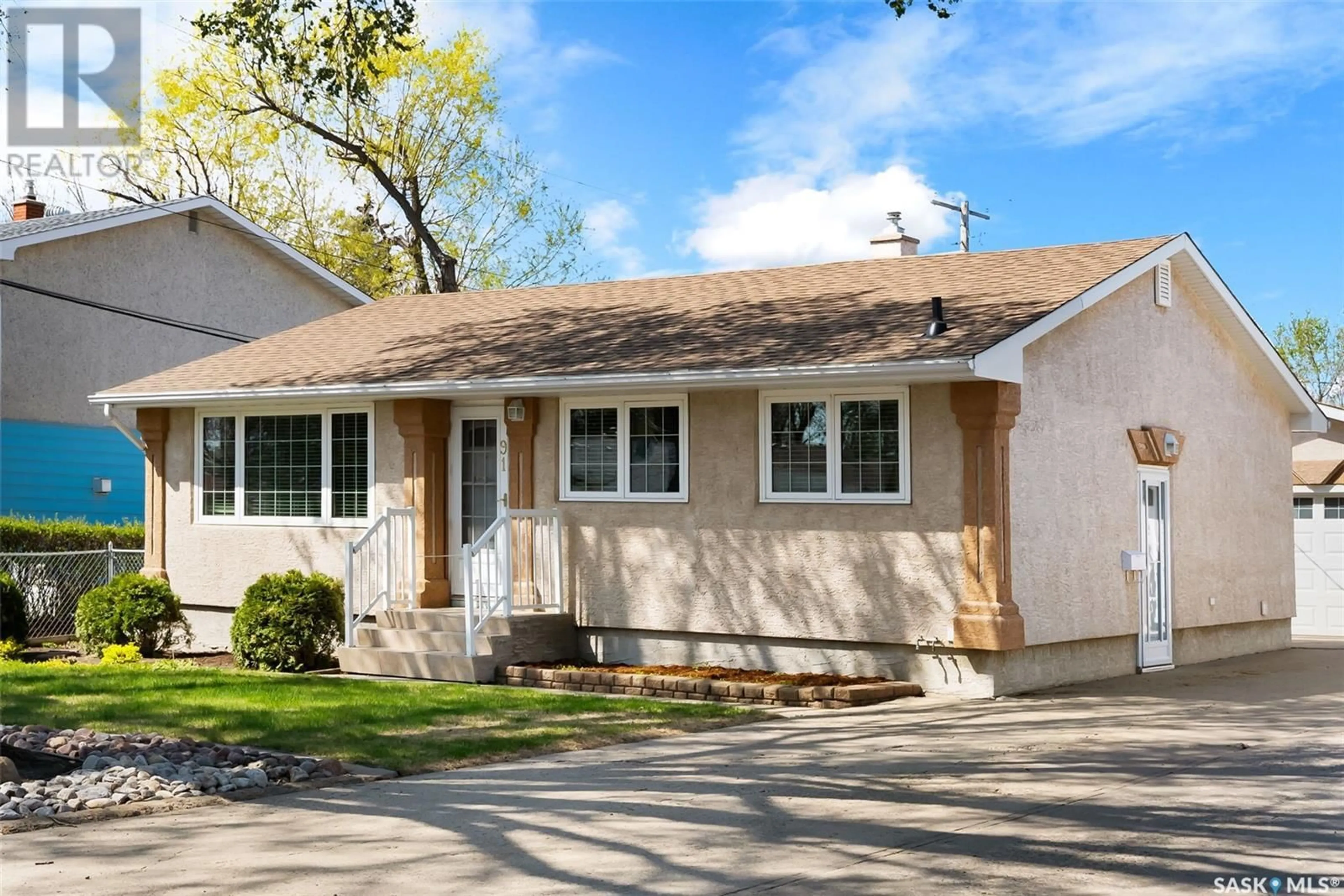 Home with vinyl exterior material, street for 91 MCINNIS CRESCENT, Regina Saskatchewan S4R3E9