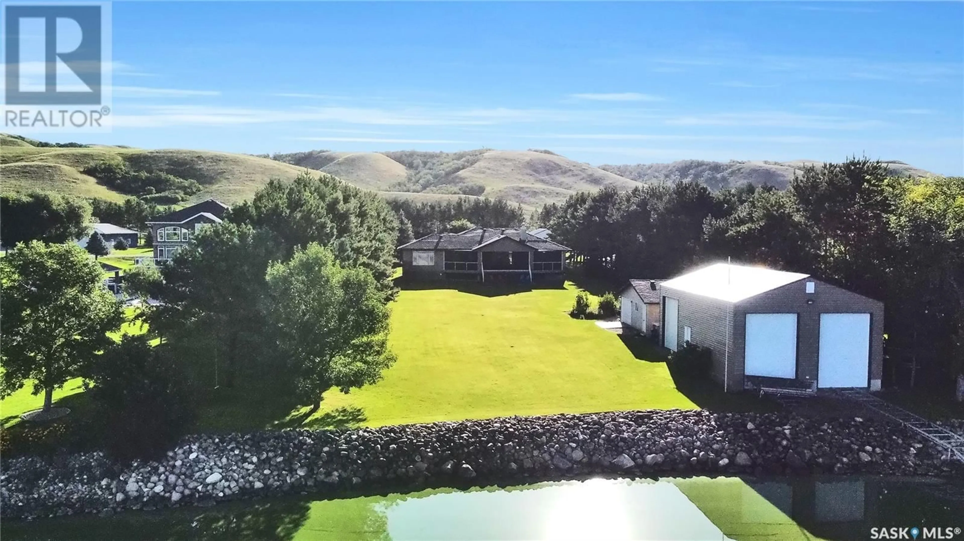 A pic from outside/outdoor area/front of a property/back of a property/a pic from drone, mountain view for 215-217 NORTH SHORE DRIVE, Buffalo Pound Lake Saskatchewan S0H4C0