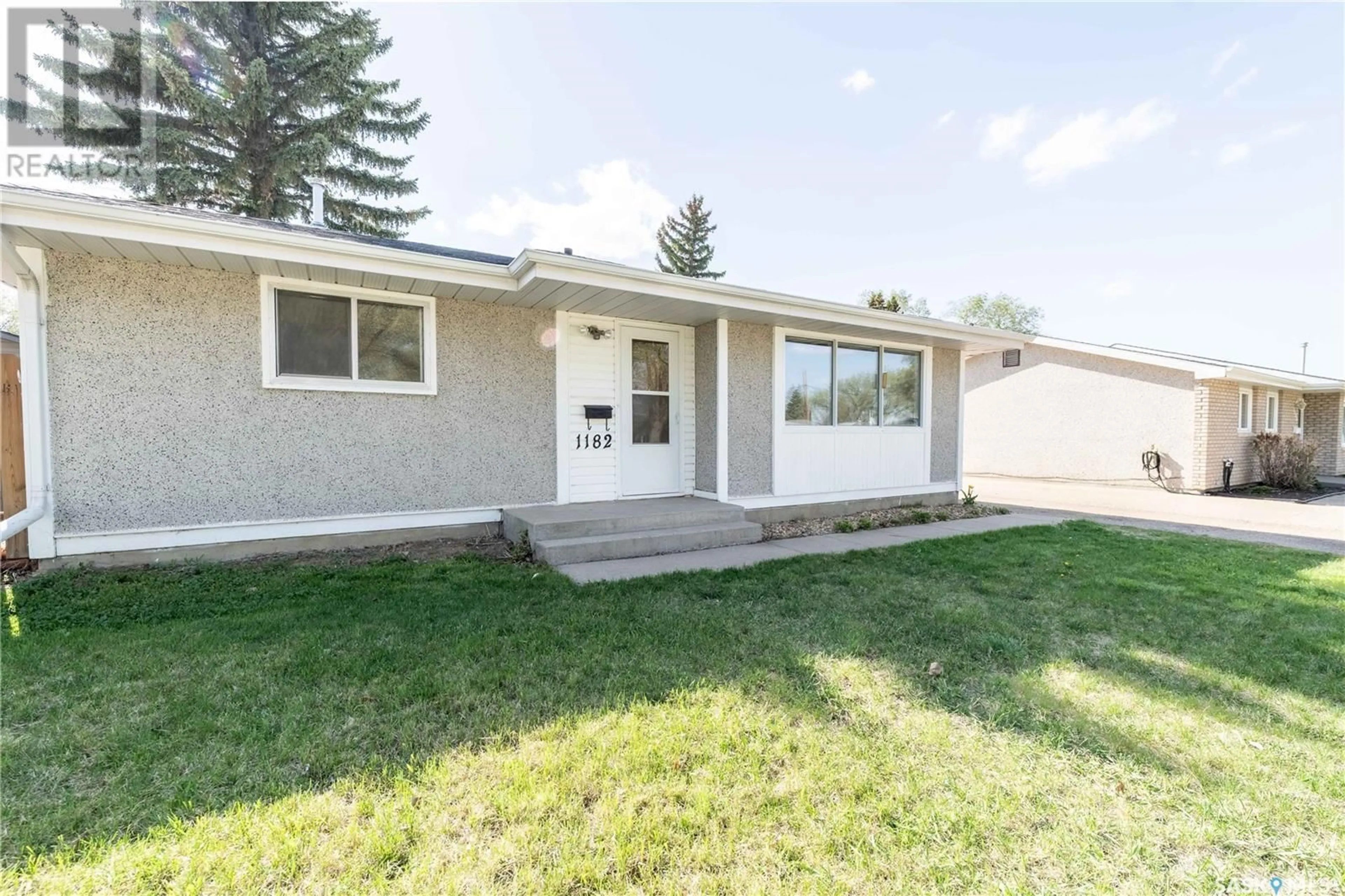 Home with vinyl exterior material, street for 1182 CURRIE CRESCENT, Moose Jaw Saskatchewan S6H6B7