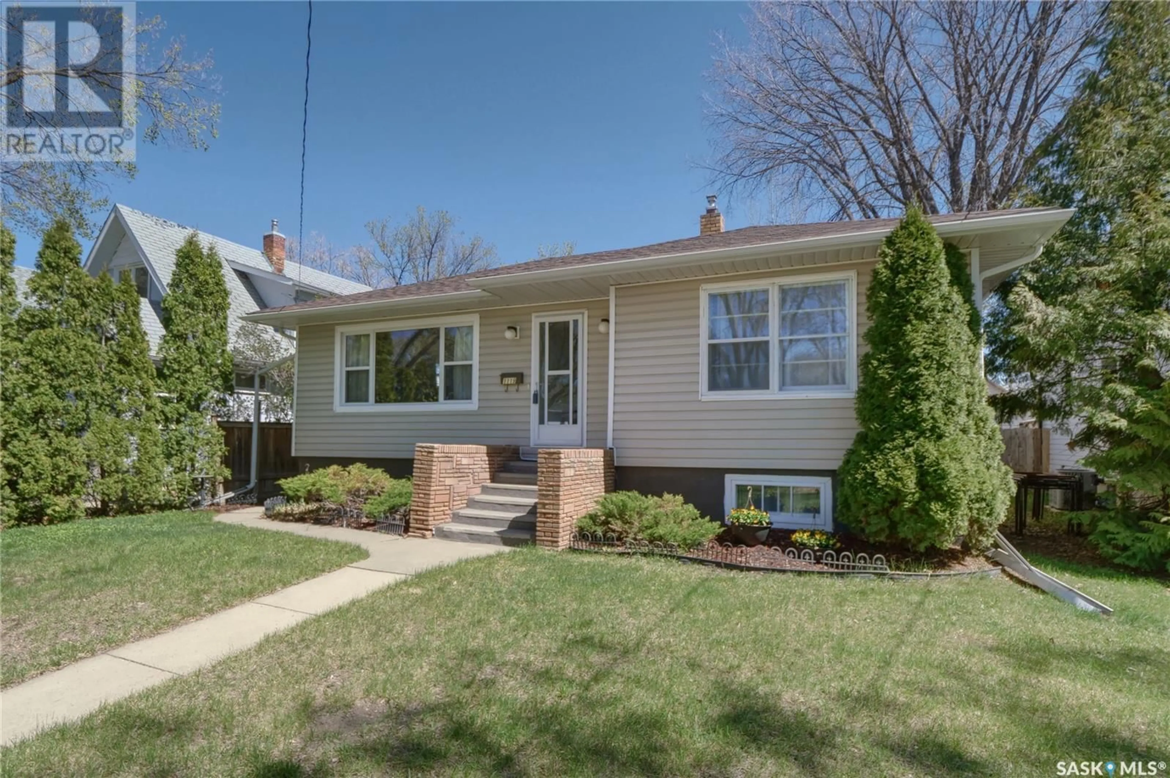 Home with vinyl exterior material, street for 1119 6TH AVENUE, Moose Jaw Saskatchewan S6H4A7