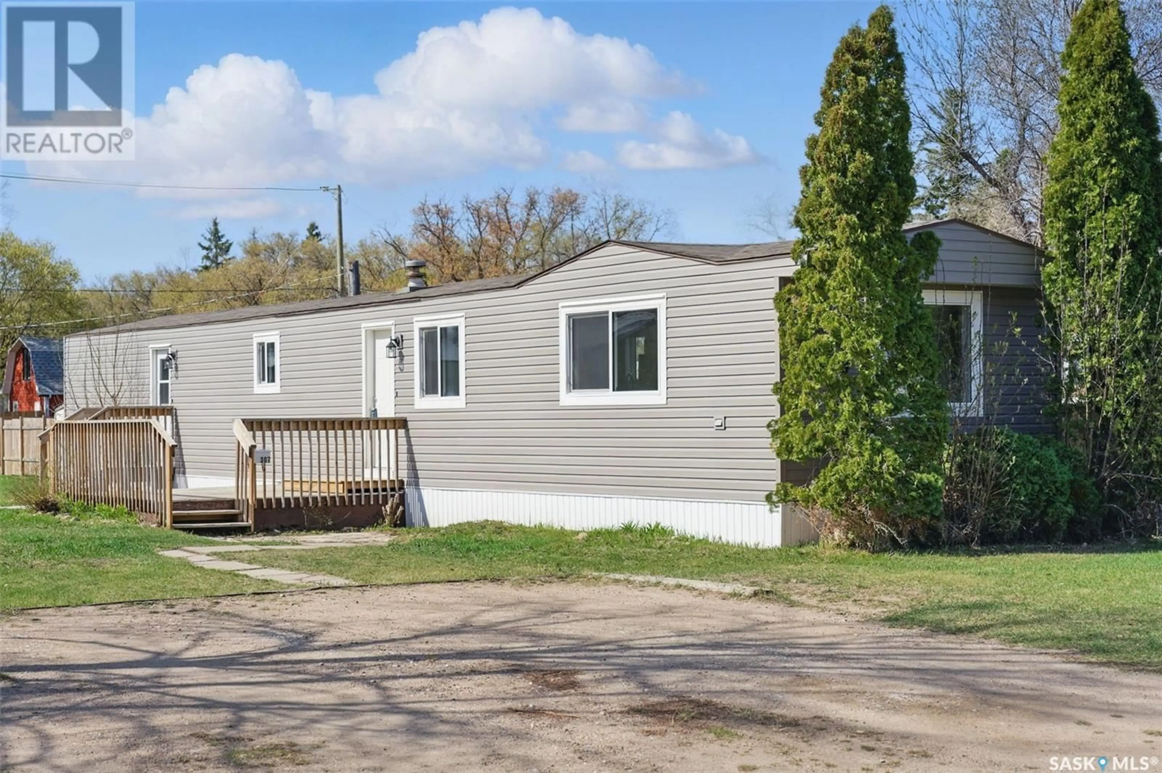 Home with vinyl exterior material, street for 307 CLOVER AVENUE, Dalmeny Saskatchewan S7L2L1