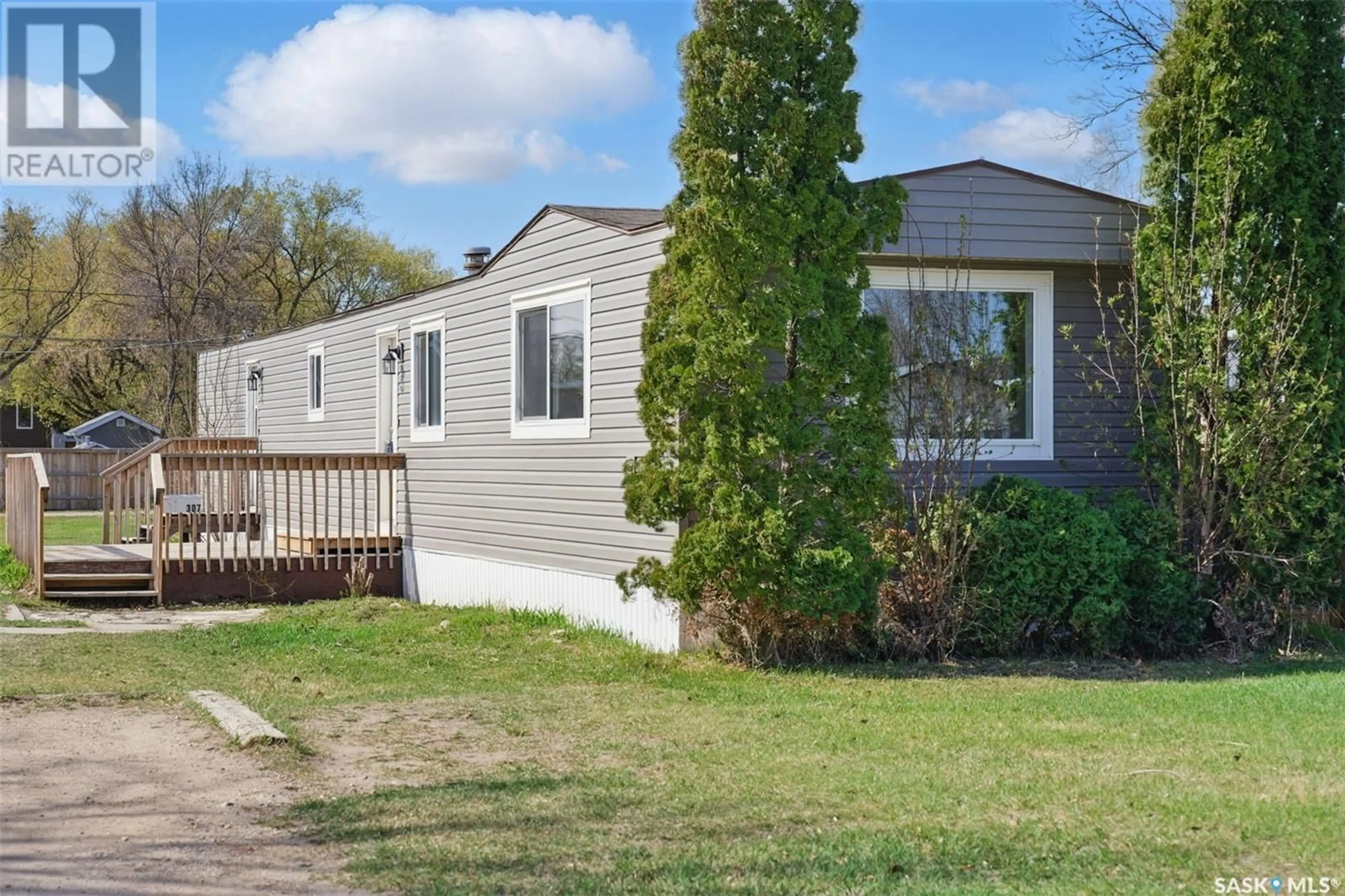 Home with vinyl exterior material, street for 307 CLOVER AVENUE, Dalmeny Saskatchewan S0K1E0