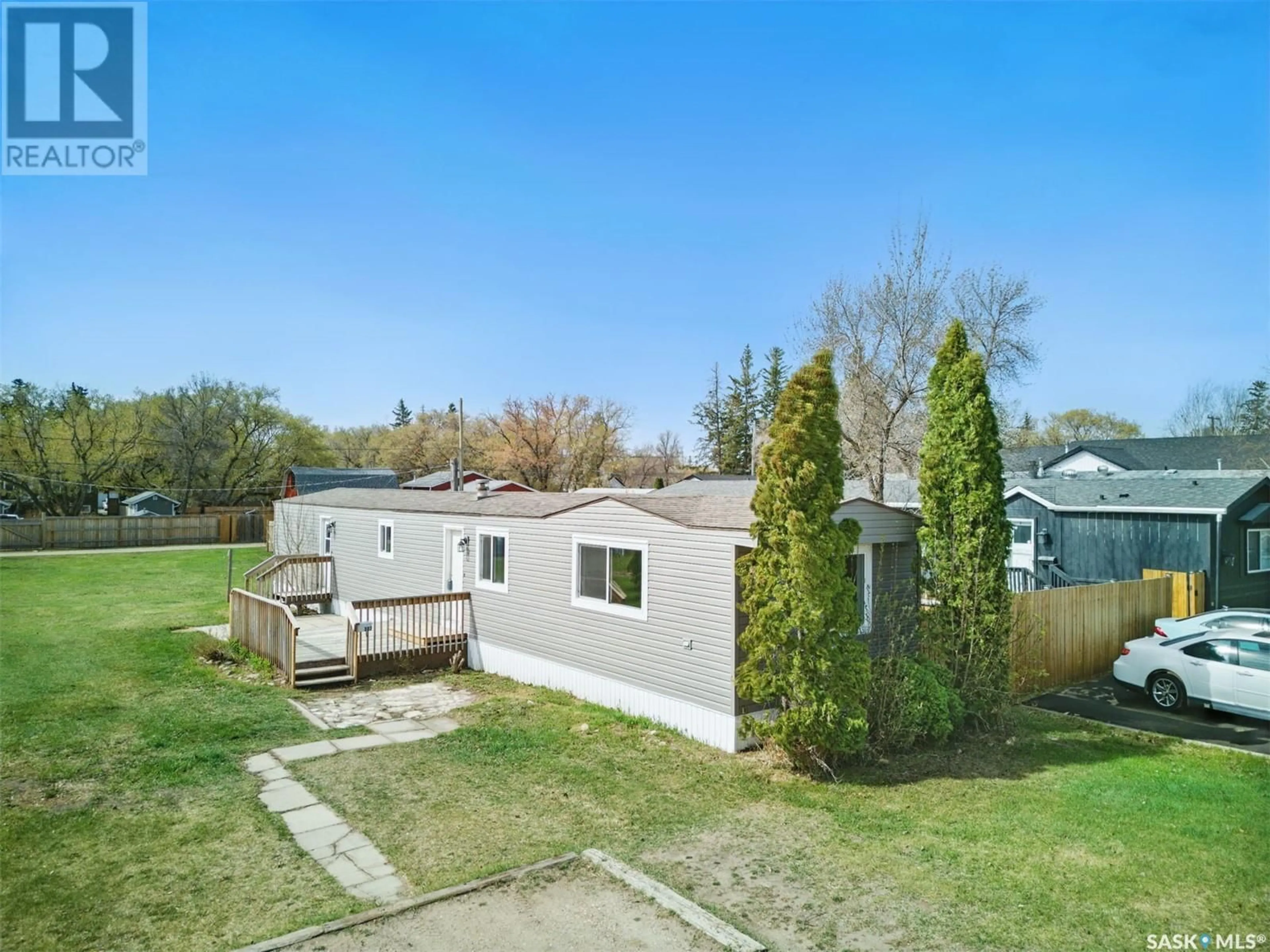 A pic from outside/outdoor area/front of a property/back of a property/a pic from drone, street for 307 CLOVER AVENUE, Dalmeny Saskatchewan S0K1E0