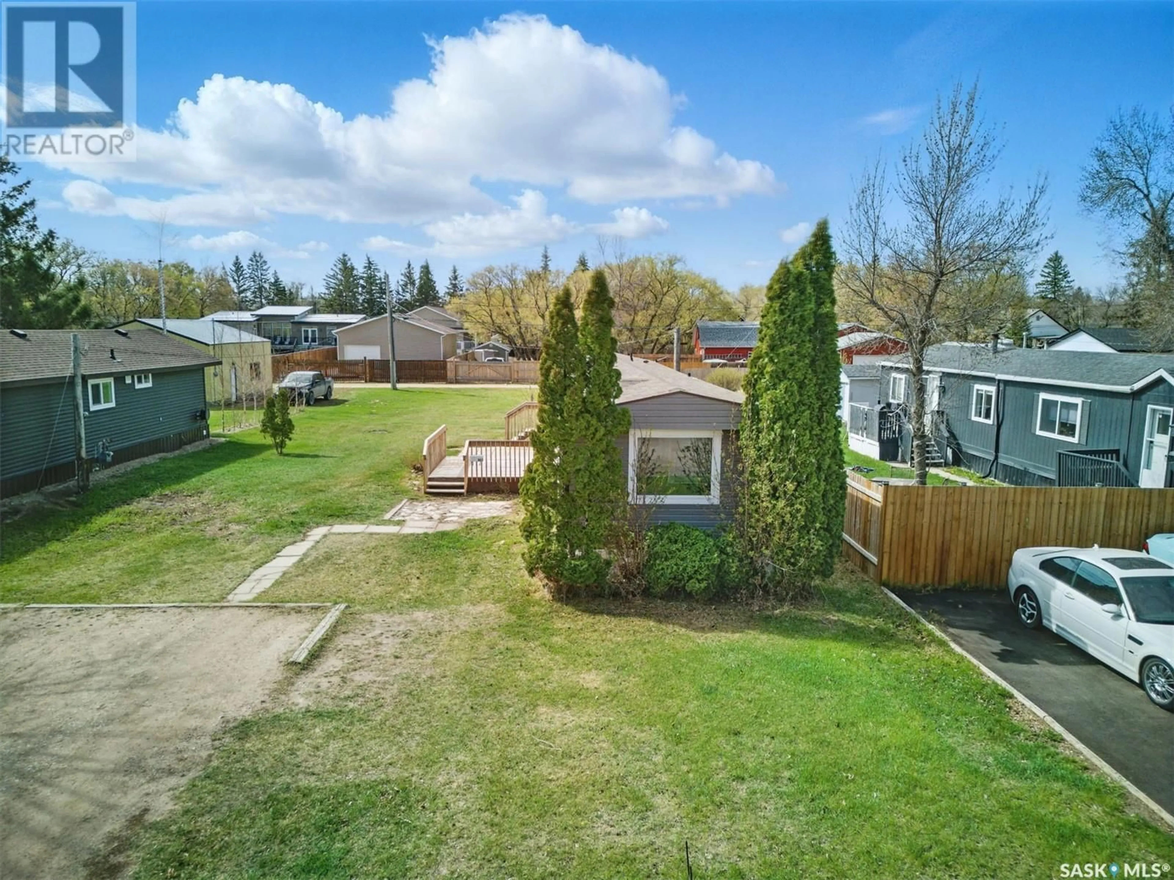 A pic from outside/outdoor area/front of a property/back of a property/a pic from drone, street for 307 CLOVER AVENUE, Dalmeny Saskatchewan S0K1E0