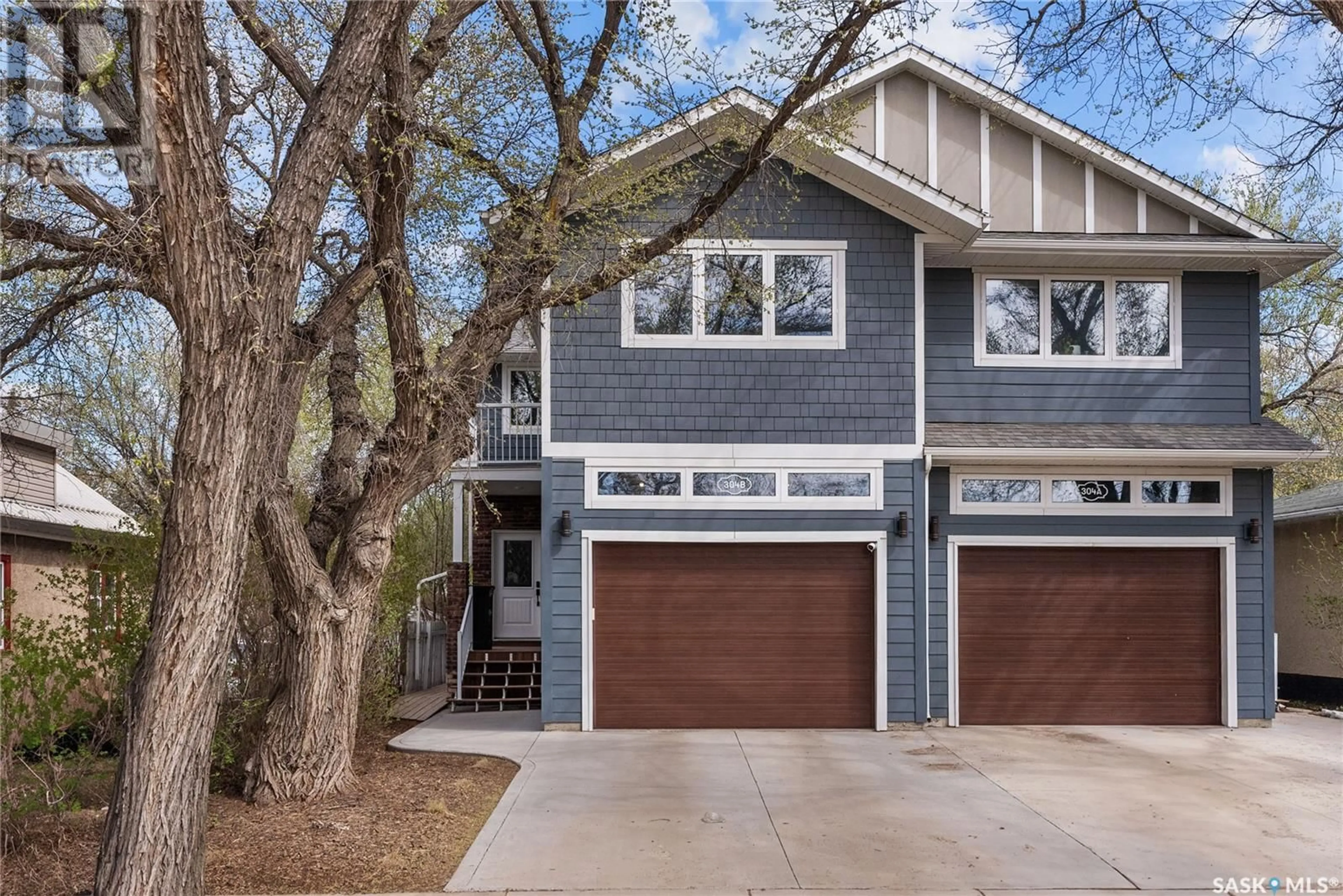 Home with vinyl exterior material, street for 304B 111TH STREET, Saskatoon Saskatchewan S7N1T3
