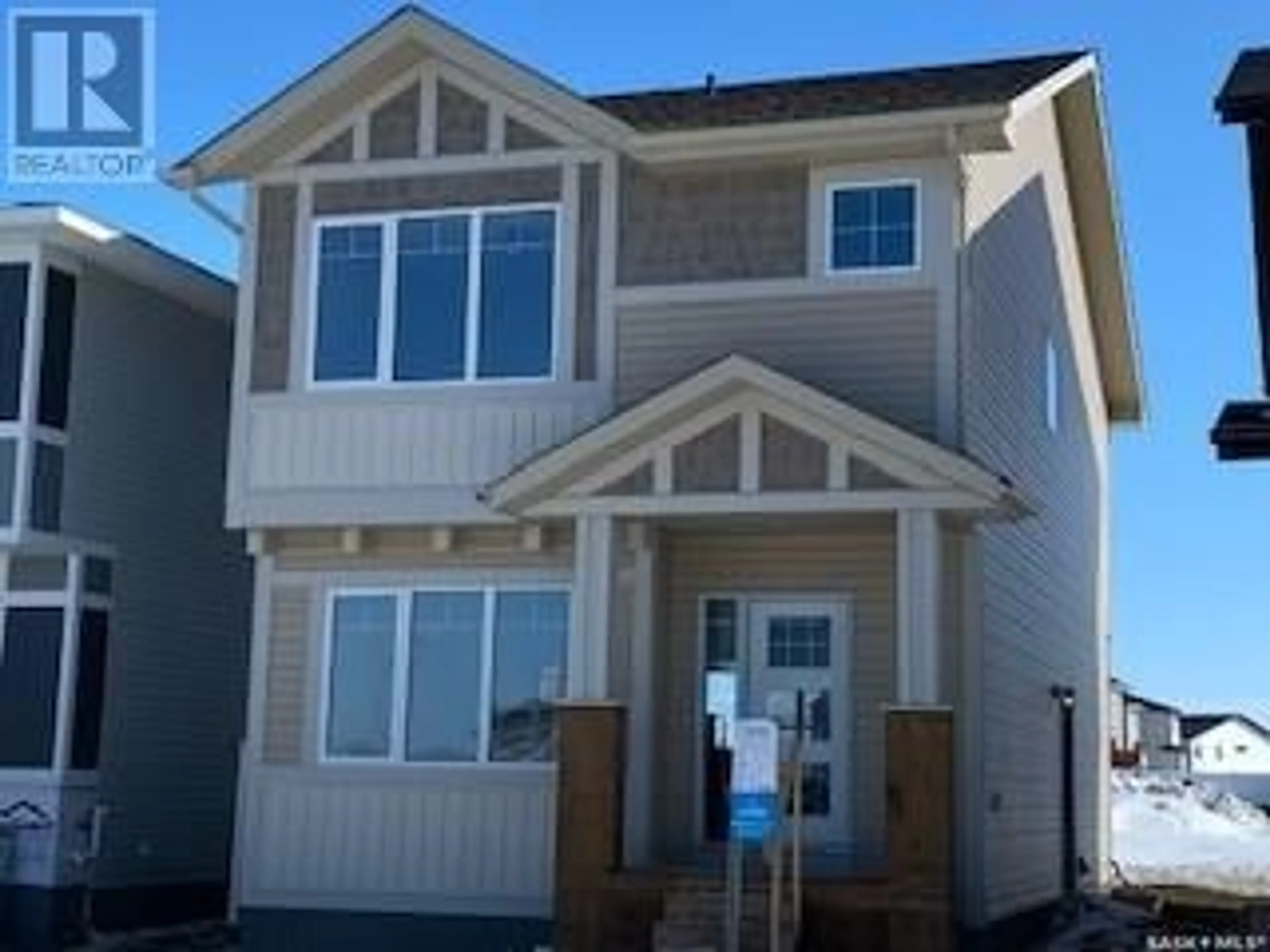 Home with vinyl exterior material, street for 326 COWESSESS ROAD, Saskatoon Saskatchewan S7V1Y4