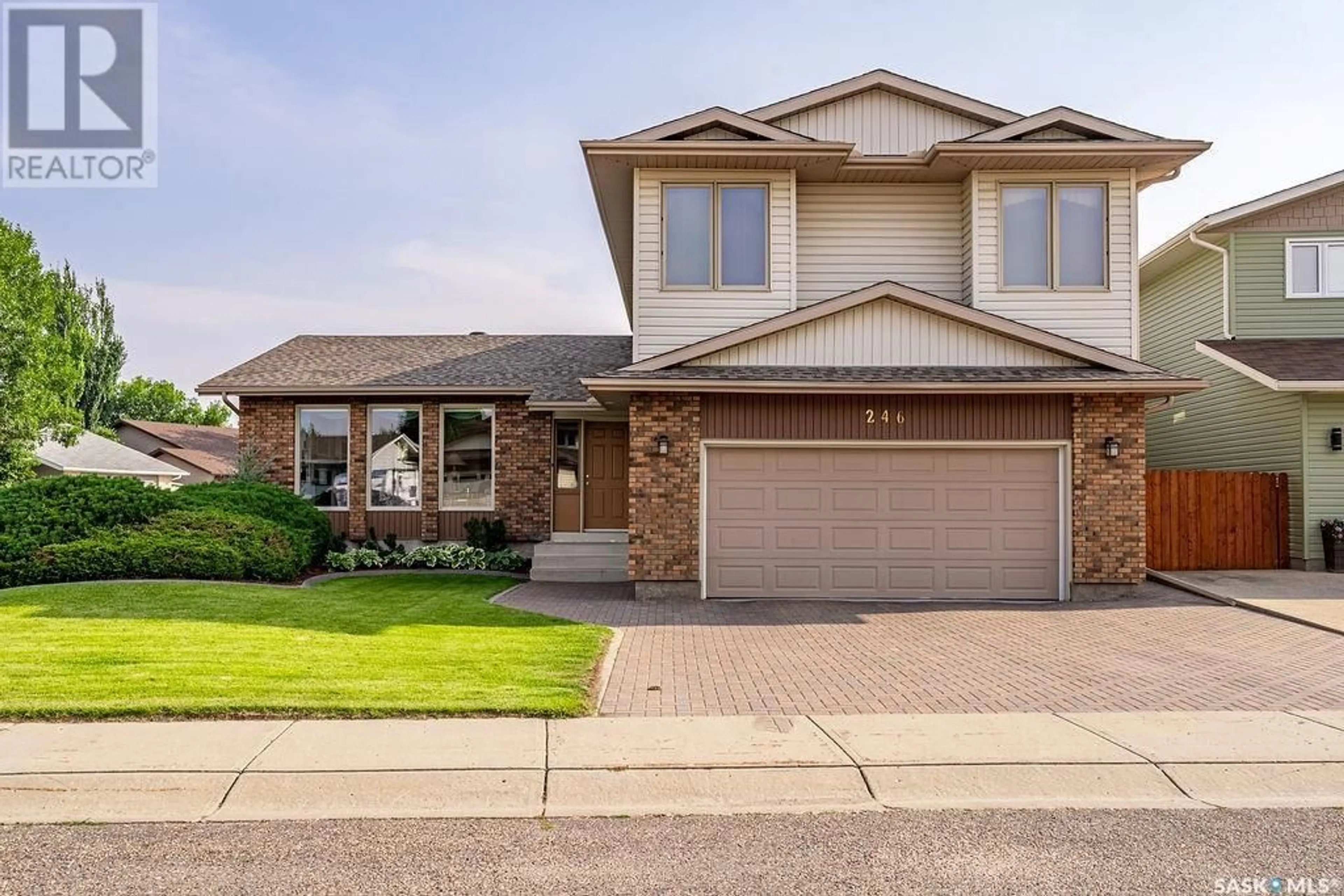 Home with brick exterior material, street for 246 BAKER PLACE, Saskatoon Saskatchewan S7N3L1