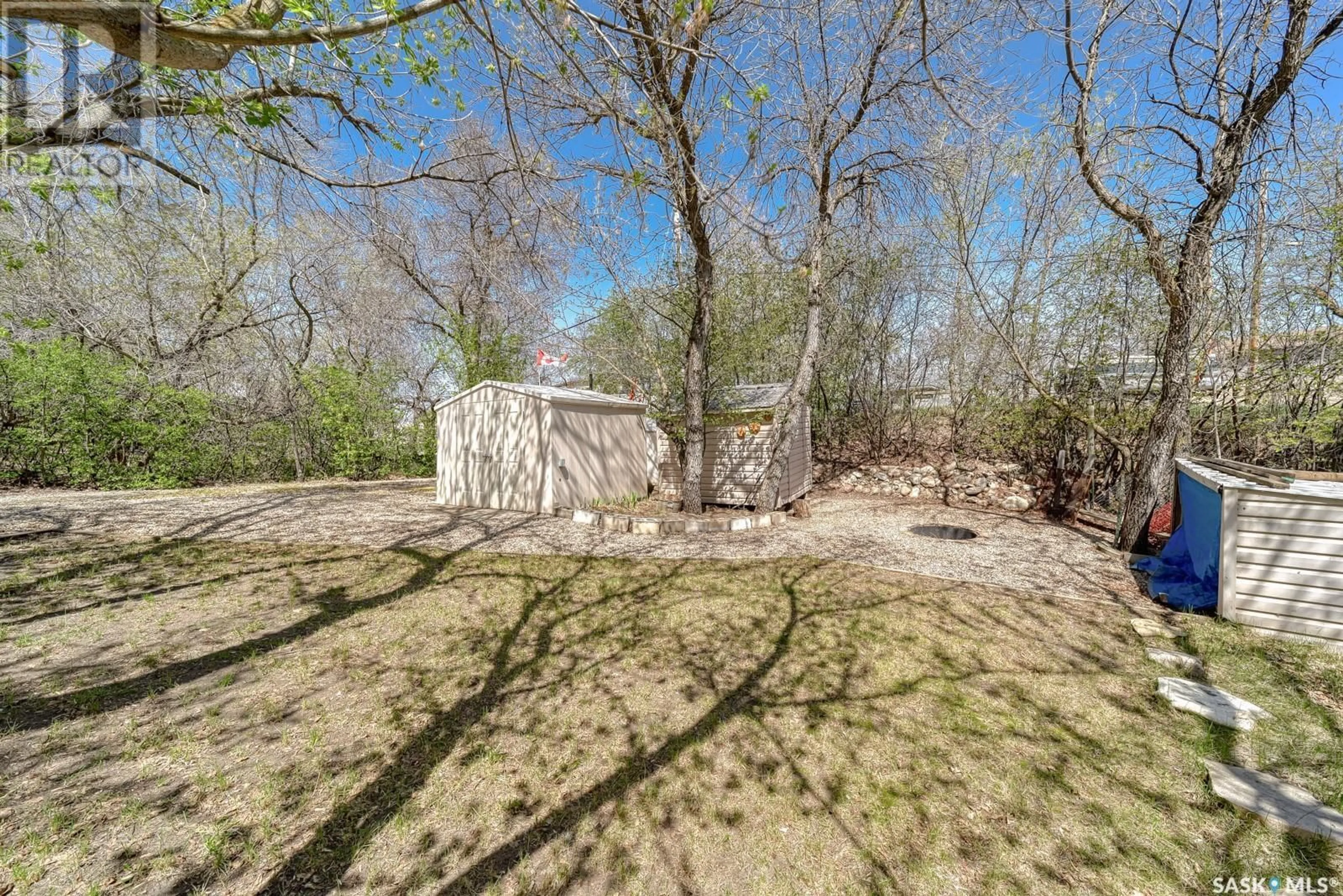 A pic from outside/outdoor area/front of a property/back of a property/a pic from drone, forest/trees view for 829 TATANKA DRIVE, Buffalo Pound Lake Saskatchewan S0H4C0
