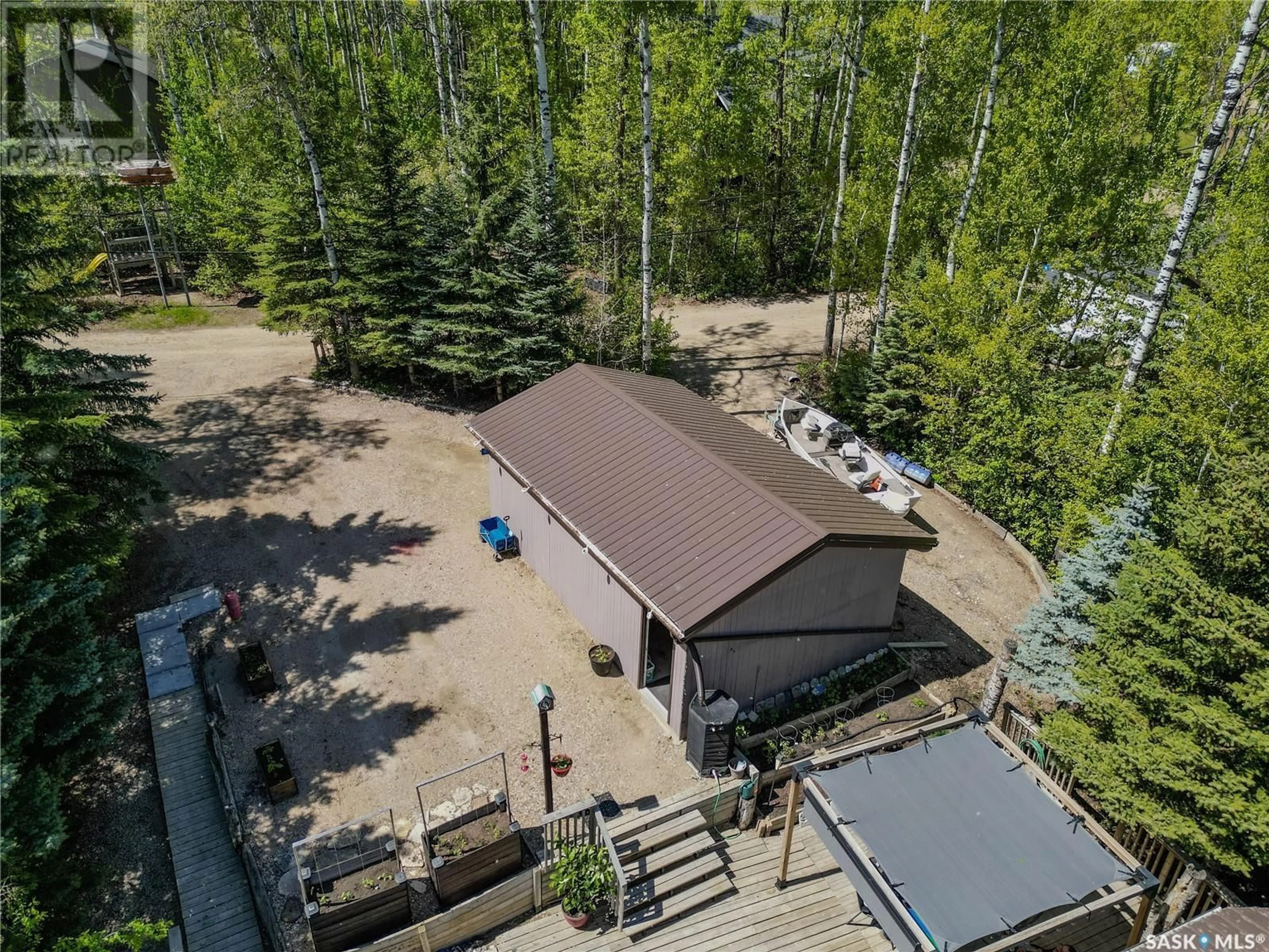 A pic from outside/outdoor area/front of a property/back of a property/a pic from drone, forest/trees view for 6 WHITE BIRCH DRIVE, Three Lakes Rm No. 400 Saskatchewan S0K2X0