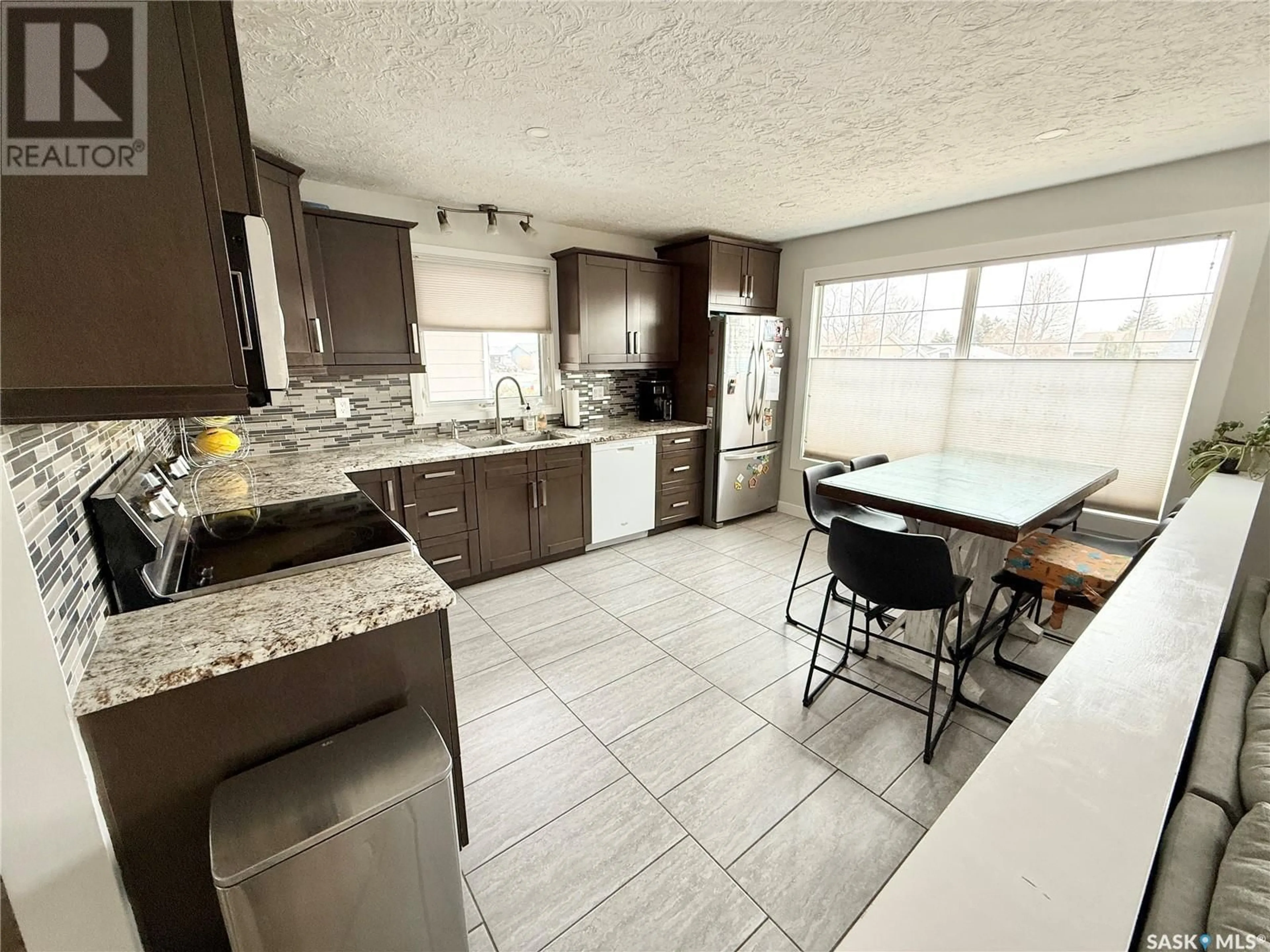 Open concept kitchen, ceramic/tile floor for 191 MONTGOMERY CRESCENT, Weyburn Saskatchewan S4H2X6