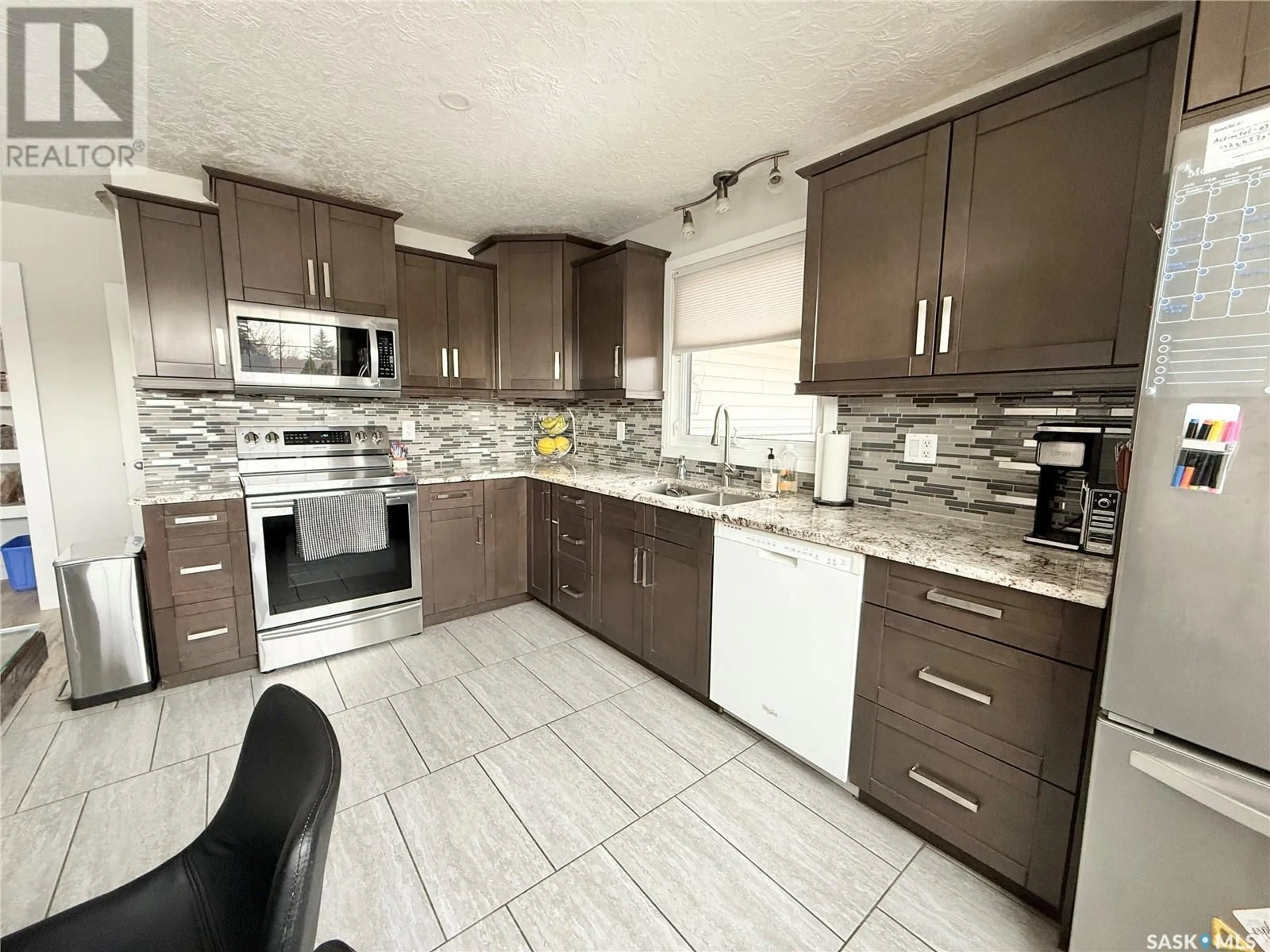 Open concept kitchen, ceramic/tile floor for 191 MONTGOMERY CRESCENT, Weyburn Saskatchewan S4H2X6