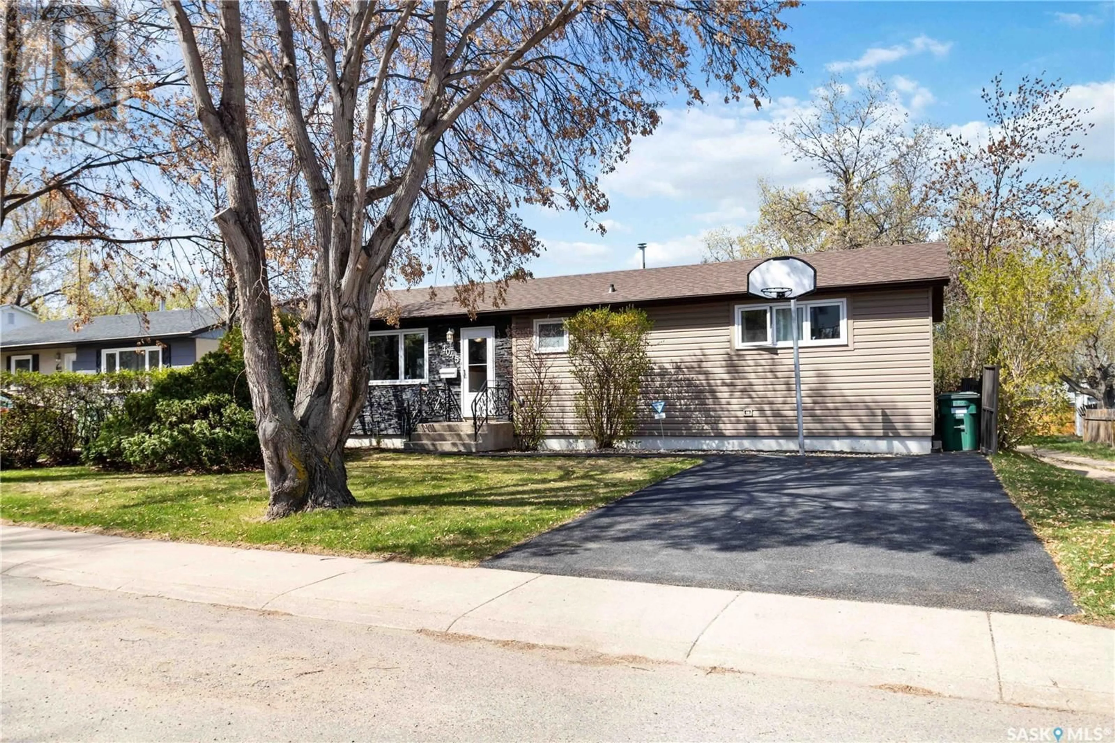 Home with vinyl exterior material, street for 1045 MAHONEY AVENUE, Saskatoon Saskatchewan S7L3Z2