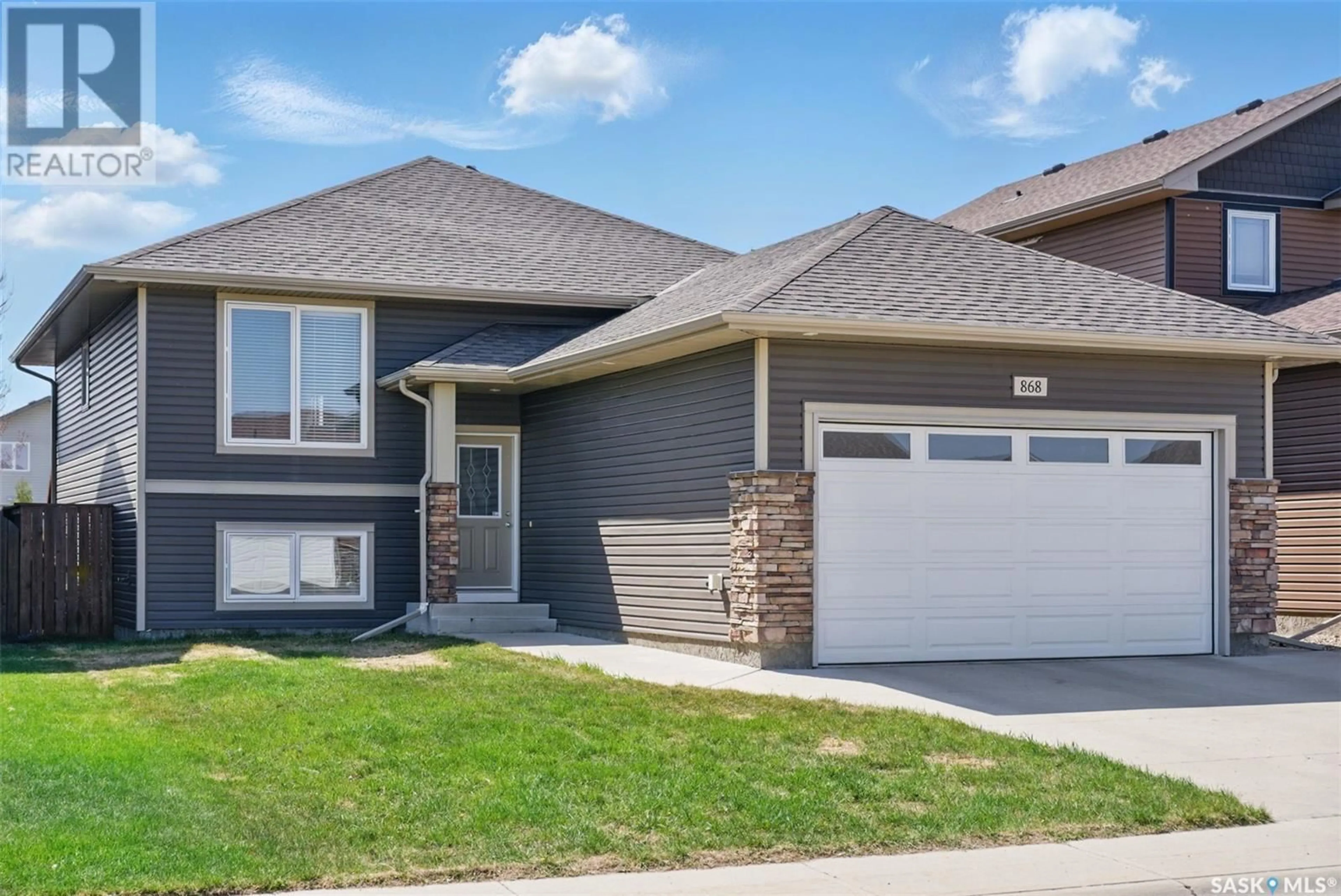 Home with brick exterior material, street for 868 REIMER ROAD, Martensville Saskatchewan S0K2A0