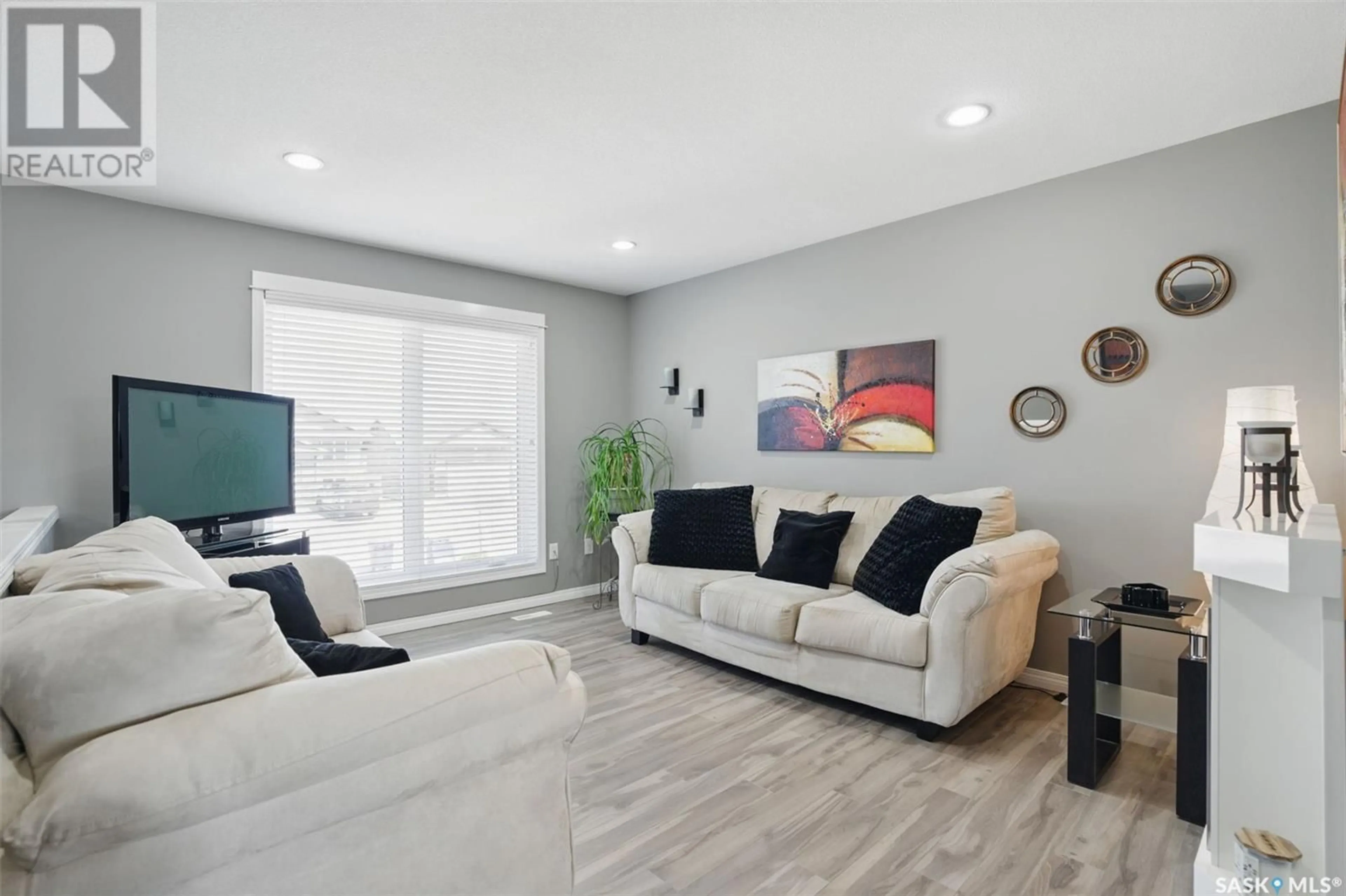 Living room with furniture, wood/laminate floor for 868 REIMER ROAD, Martensville Saskatchewan S0K2A0