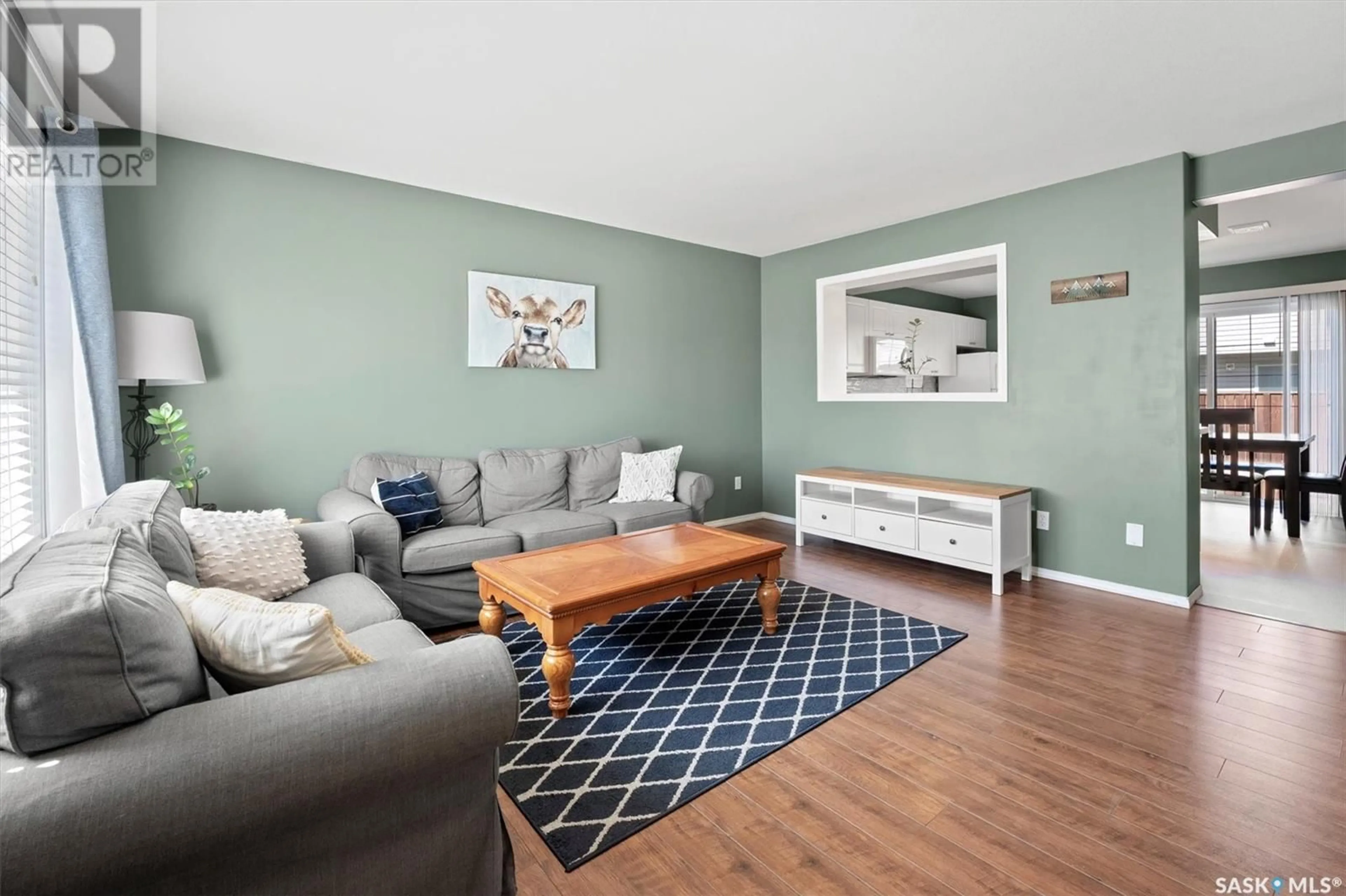 Living room with furniture, wood/laminate floor for 809 - 28 KRISTJANSON ROAD, Saskatoon Saskatchewan S7S1M8