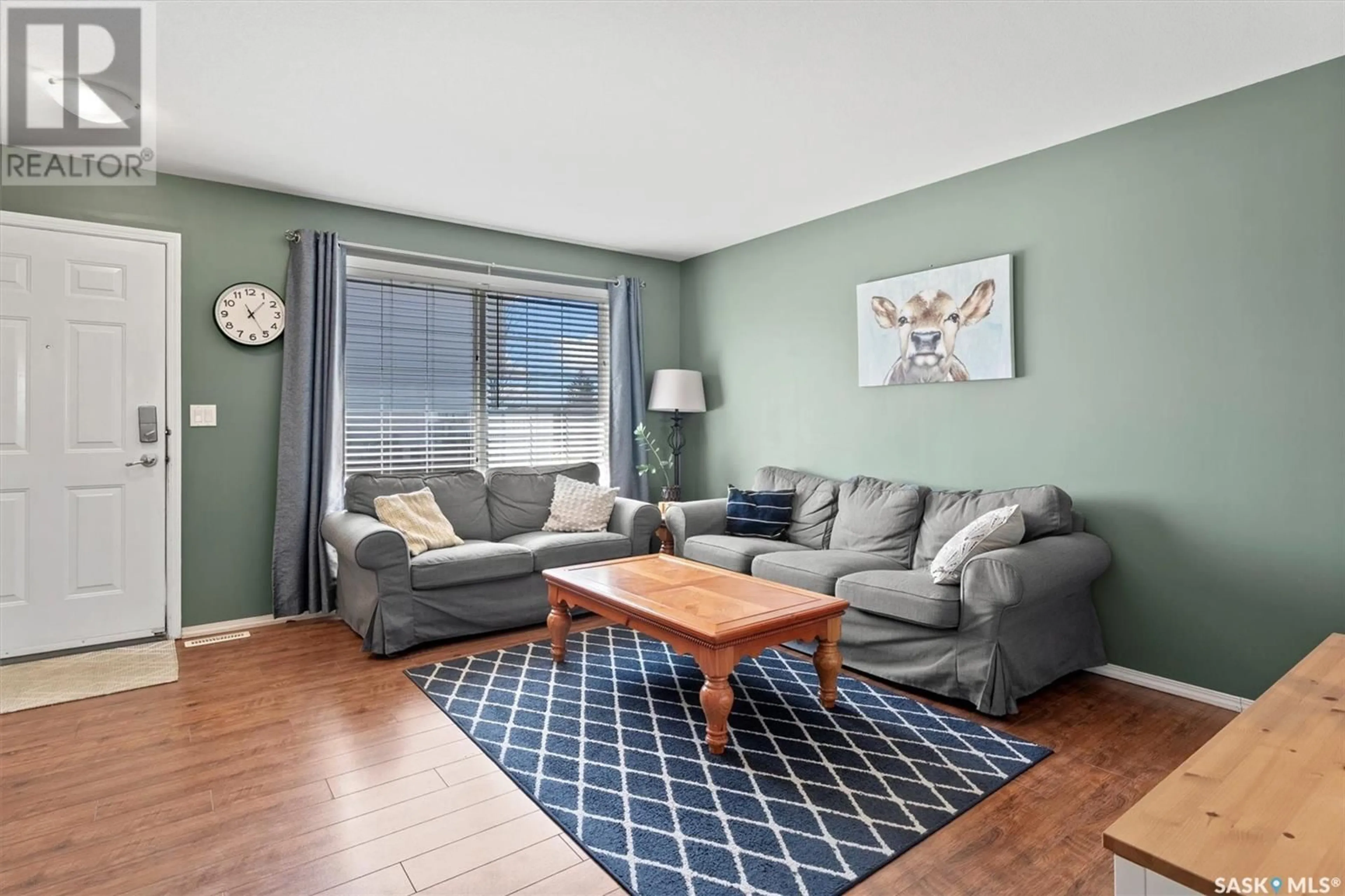 Living room with furniture, wood/laminate floor for 809 - 28 KRISTJANSON ROAD, Saskatoon Saskatchewan S7S1M8