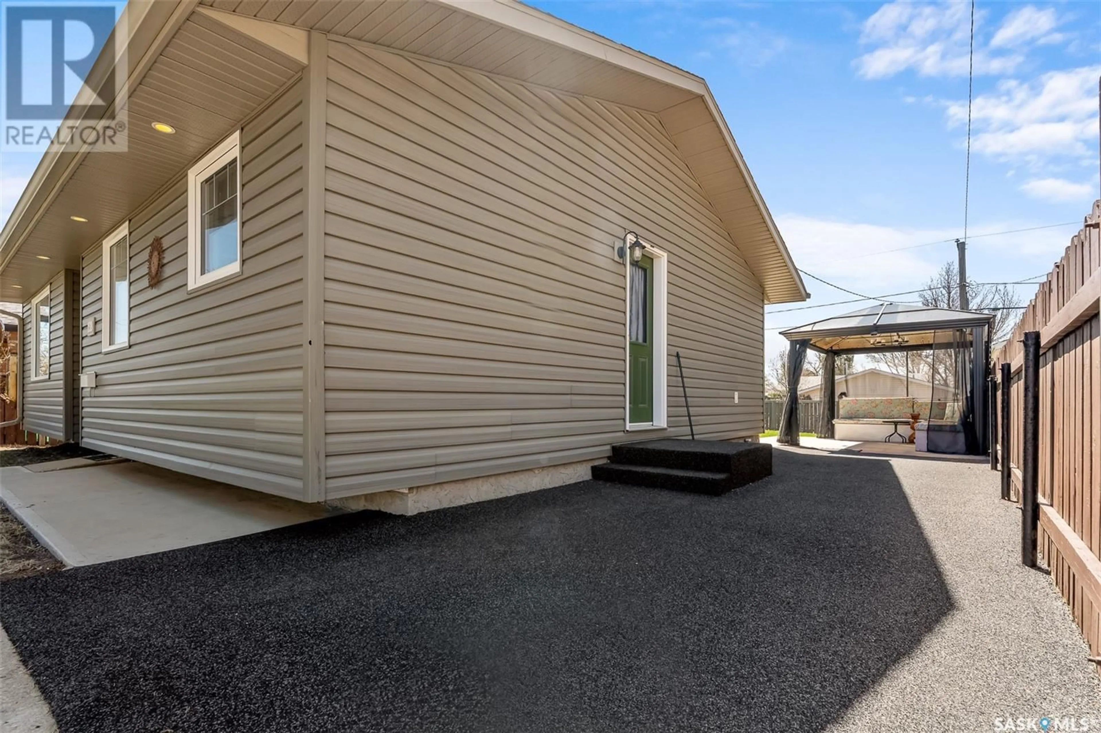 Home with vinyl exterior material, street for 1519 ATHABASCA STREET, Moose Jaw Saskatchewan S6H6C2