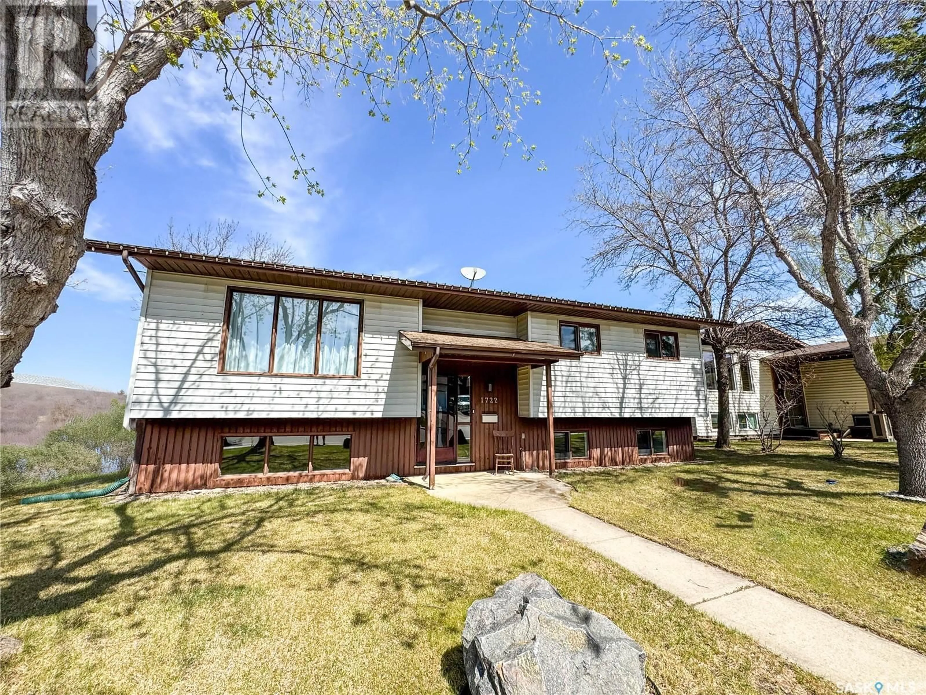 Home with vinyl exterior material, street for 1722 DAISLEY ROAD, Prince Albert Saskatchewan S6V7E4