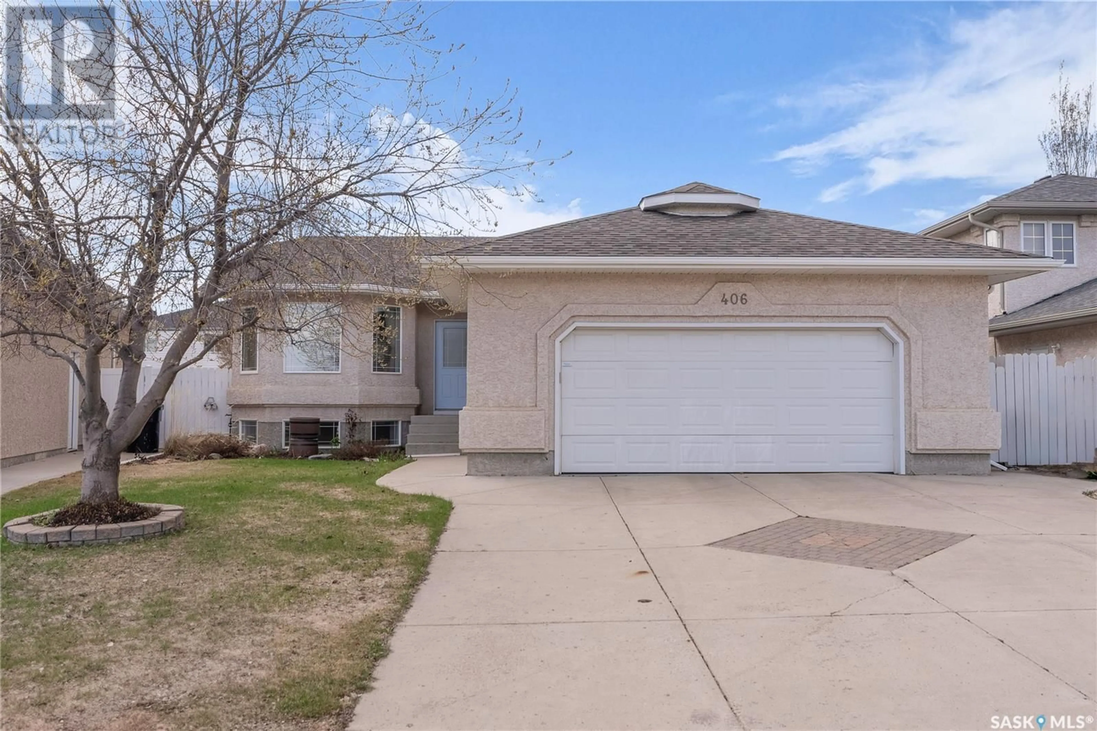 Home with vinyl exterior material, street for 406 NIXON CRESCENT, Saskatoon Saskatchewan S7L7G1