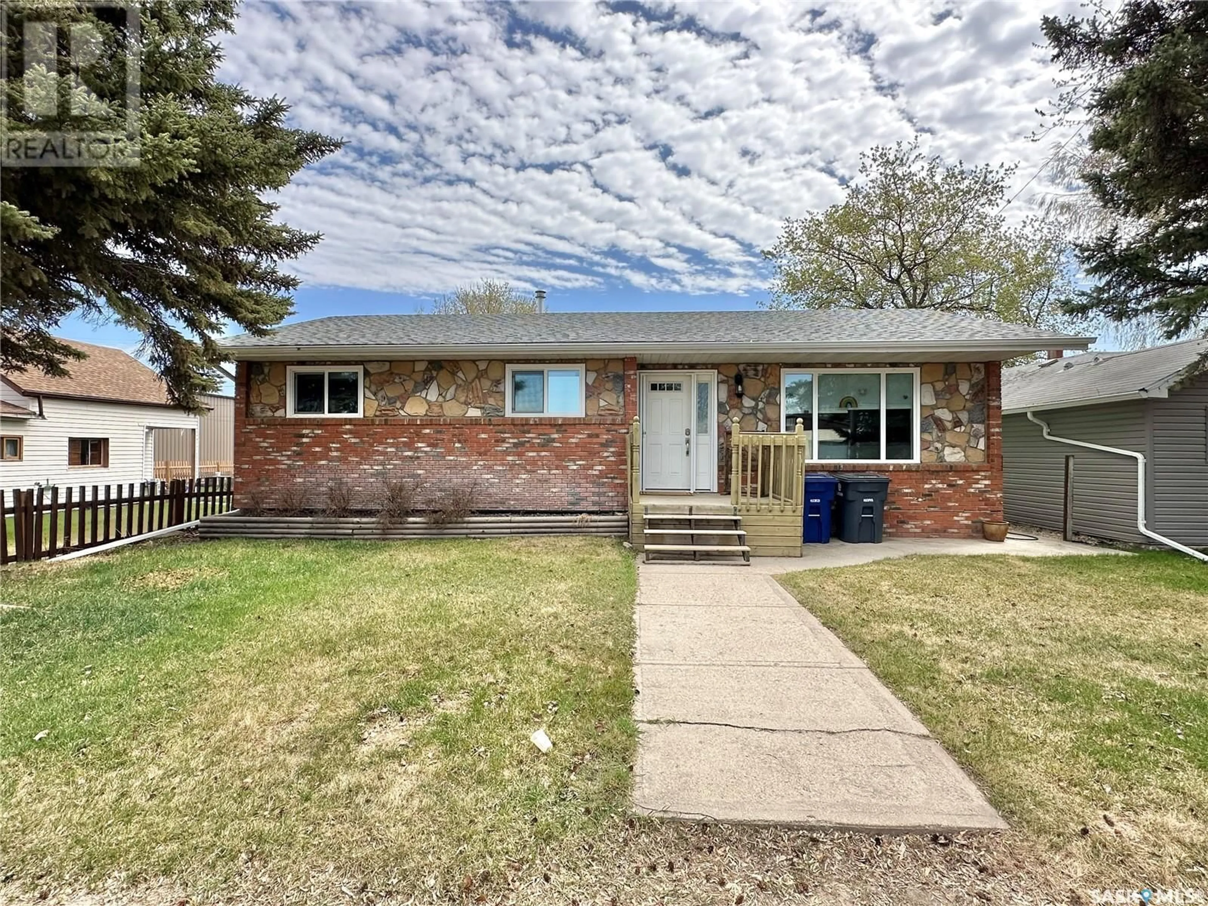 Home with brick exterior material, street for 121 FIRST STREET, Spiritwood Saskatchewan S0J2M0