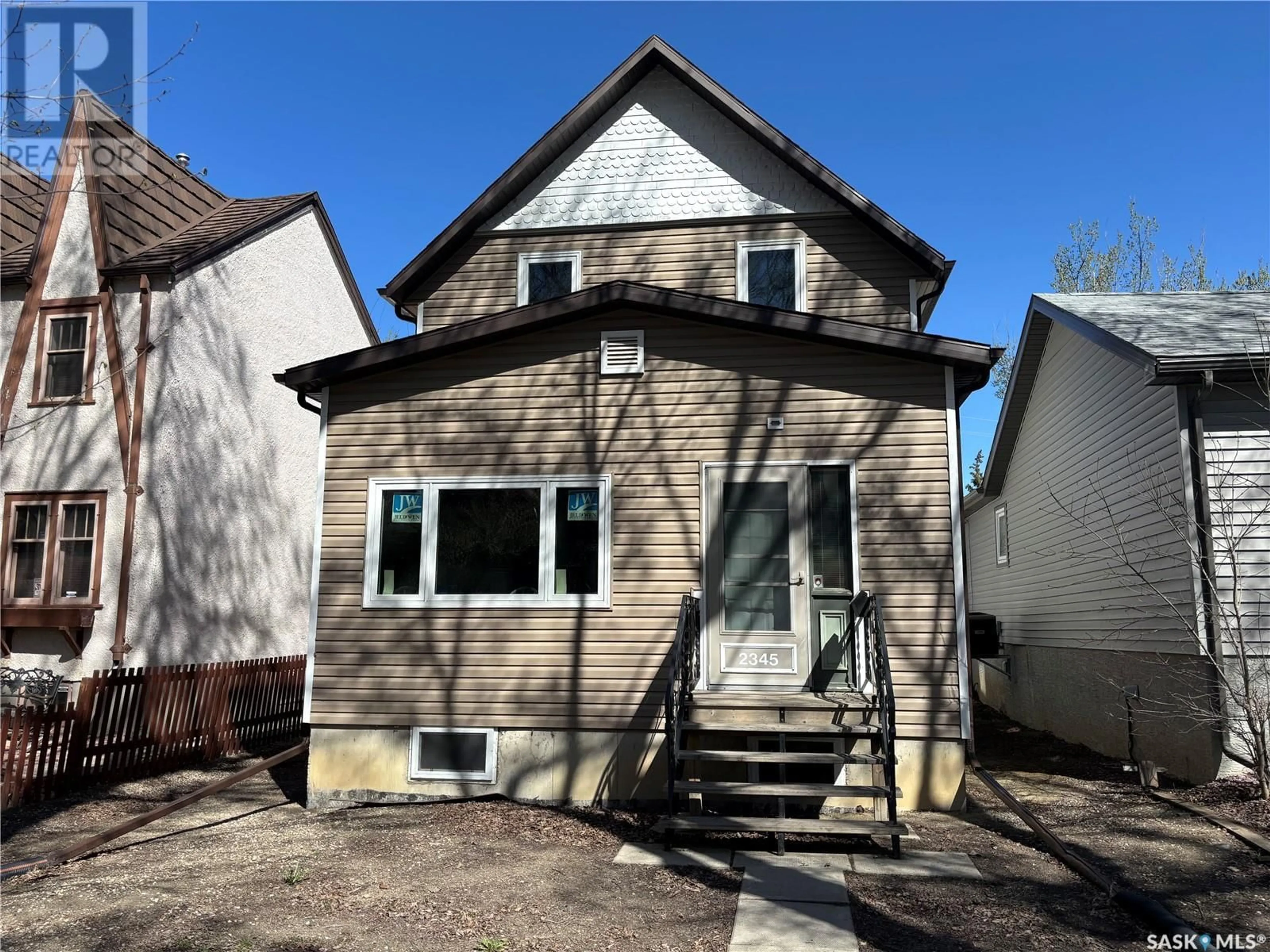 Home with vinyl exterior material, street for 2345 MONTREAL STREET, Regina Saskatchewan S4P1L9