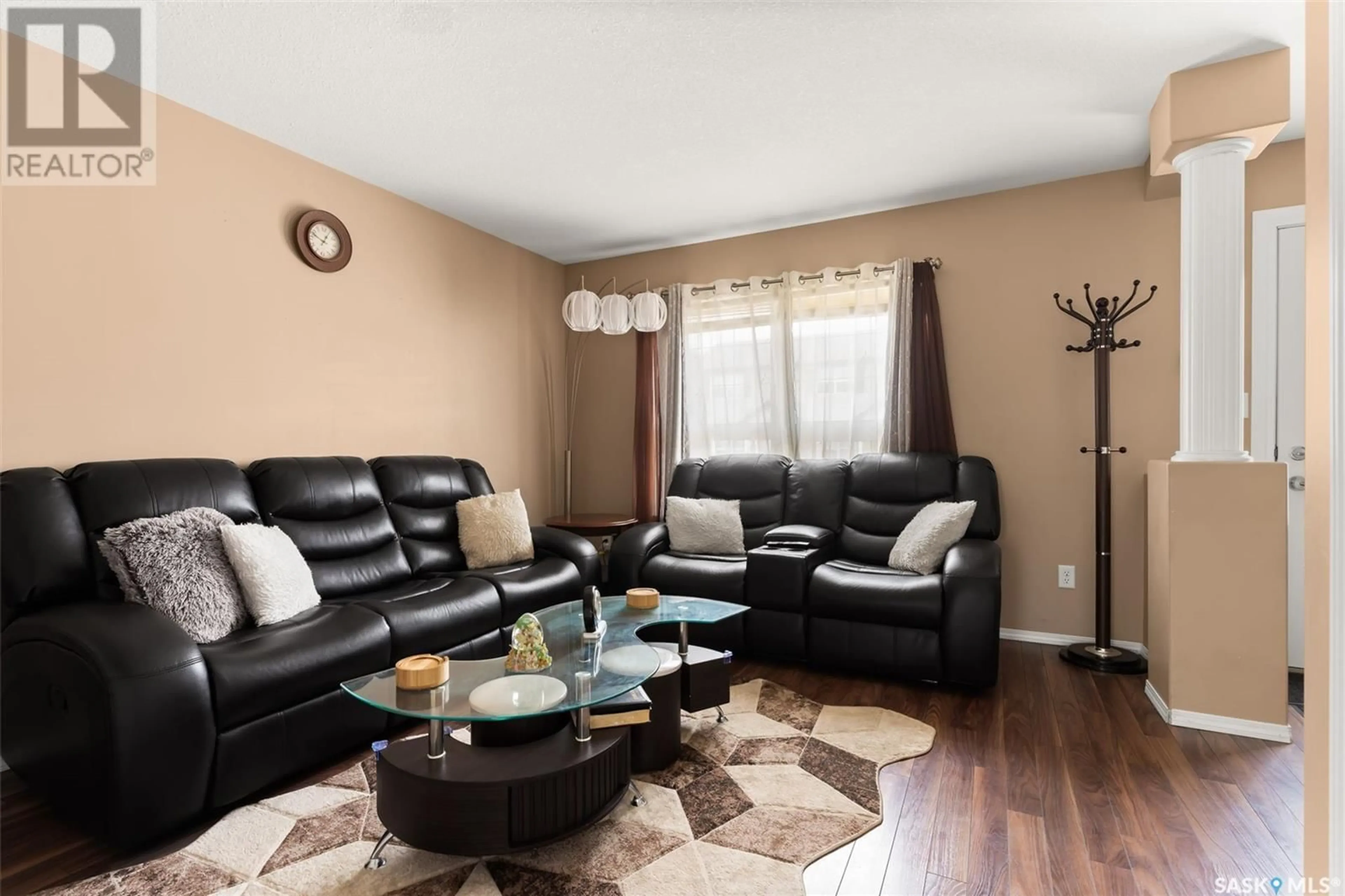 Living room with furniture, wood/laminate floor for 56 4500 CHILD AVENUE, Regina Saskatchewan S4X0A8