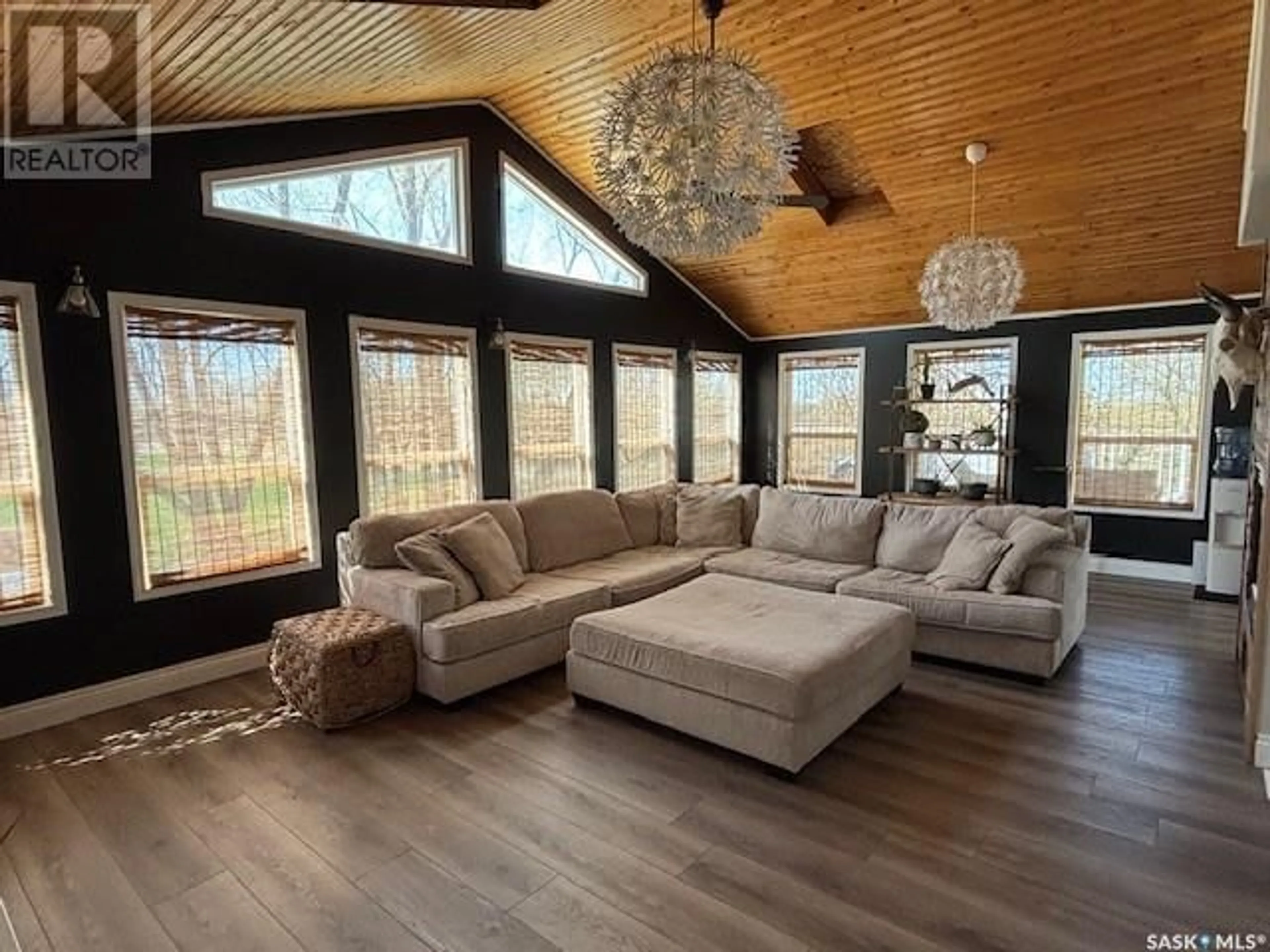 Living room with furniture, wood/laminate floor for 212 RAILWAY AVENUE, Amsterdam Saskatchewan S0A0L0