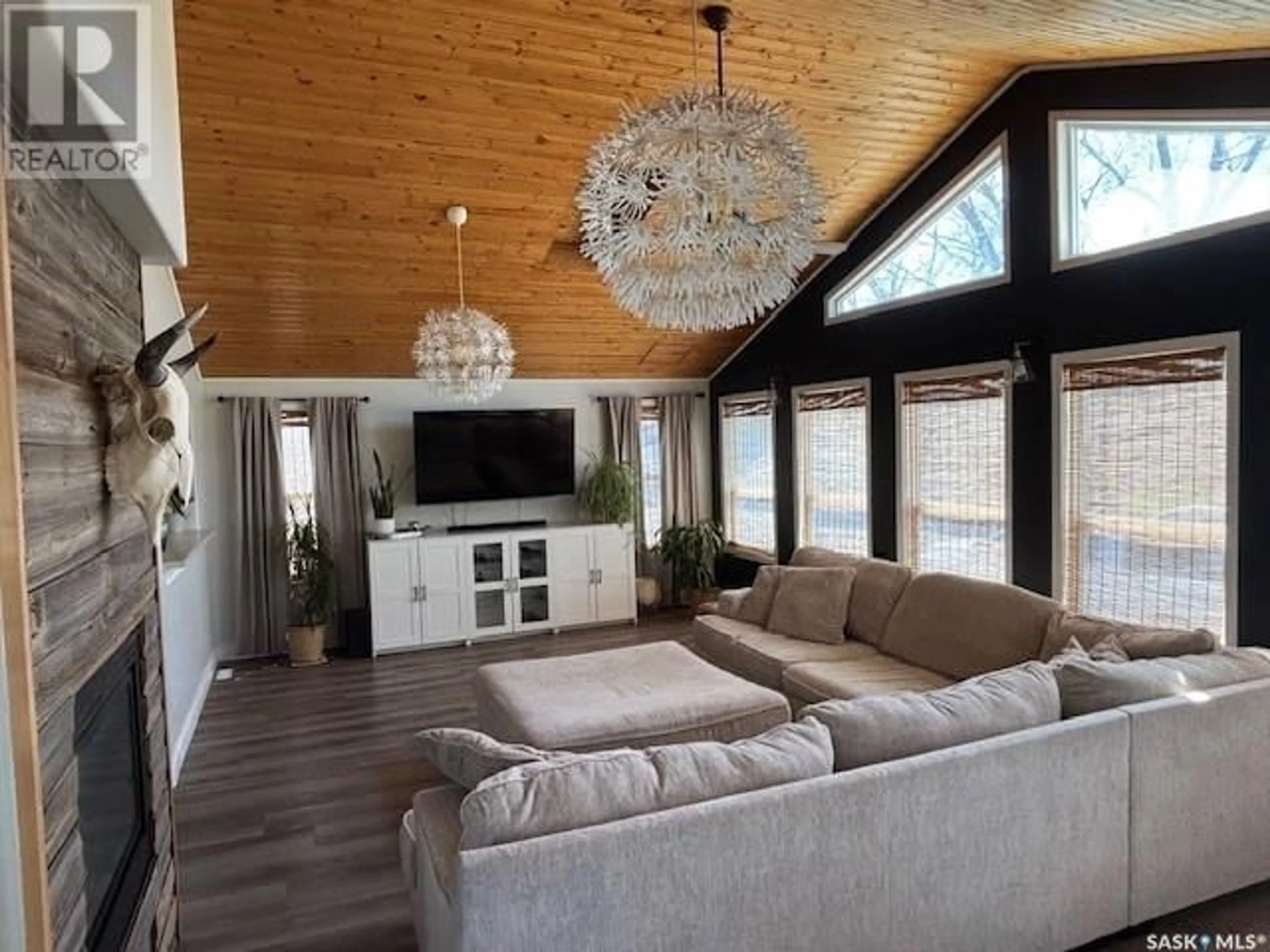 Living room with furniture, wood/laminate floor for 212 RAILWAY AVENUE, Amsterdam Saskatchewan S0A0L0